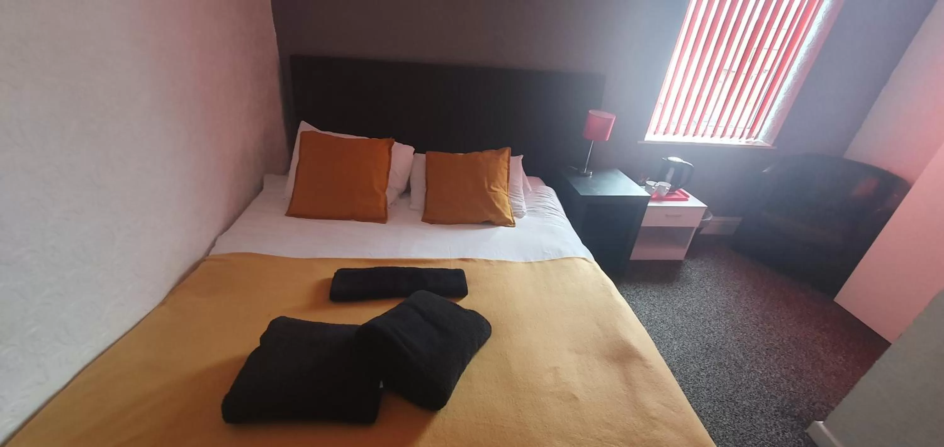 Bed in Palm Beach Hotel by the Sea