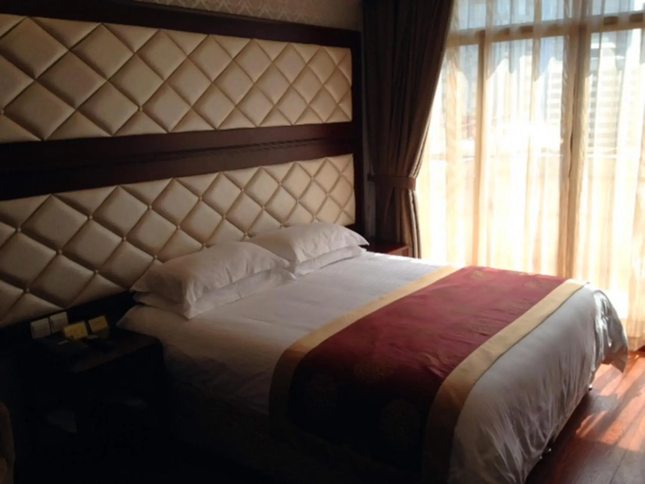 Bed in Seventh Heaven Hotel