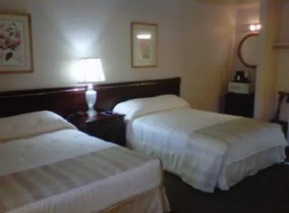 Bed in Caravelle Inn & Suites
