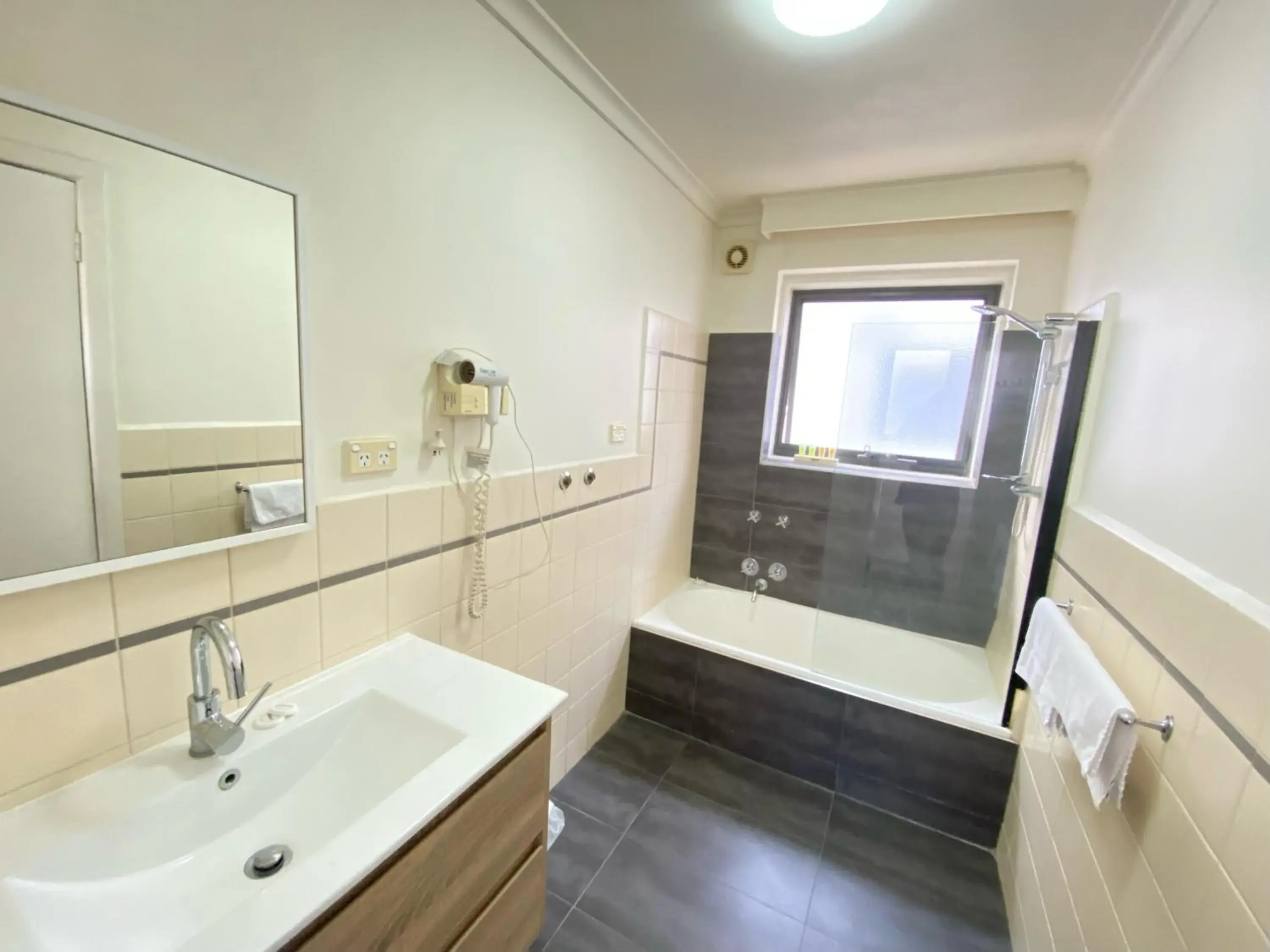 Bathroom in City Edge East Melbourne Apartment Hotel