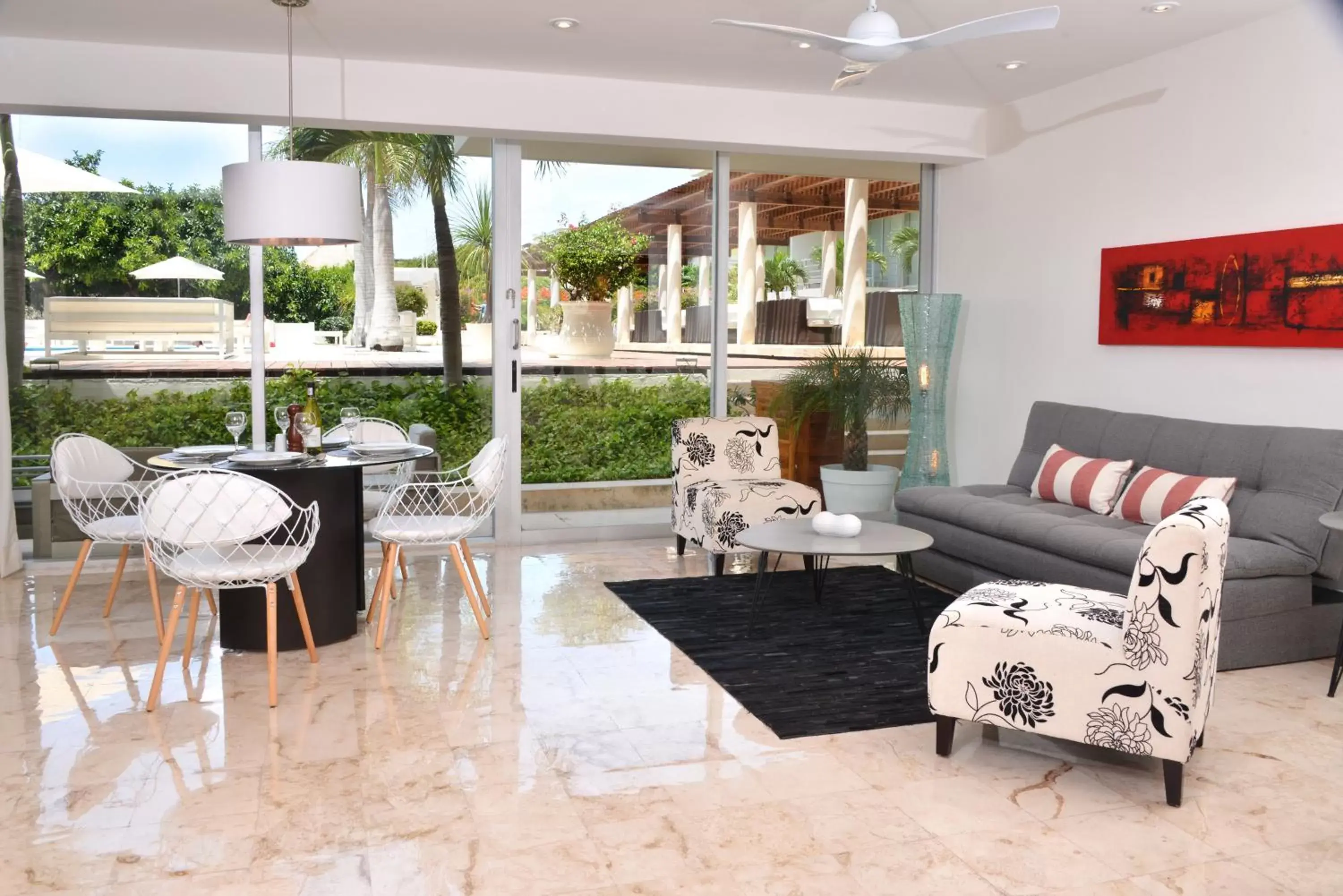 Pool view, Seating Area in Magia Beachside Condo