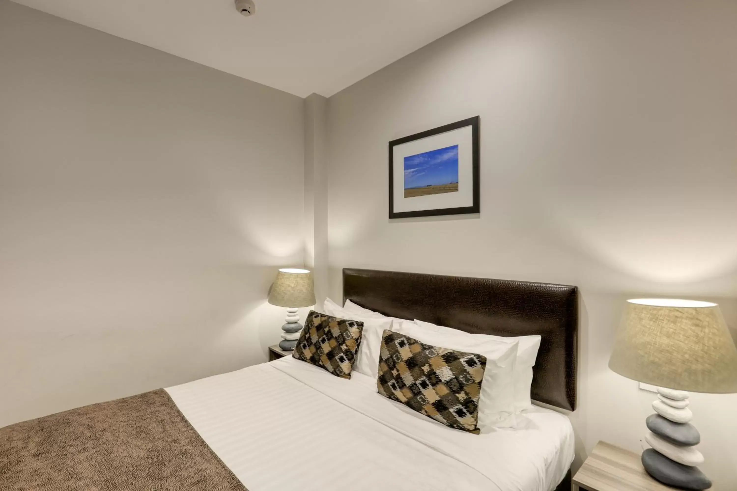 Bed in Ramada Suites by Wyndham Queenstown Remarkables Park
