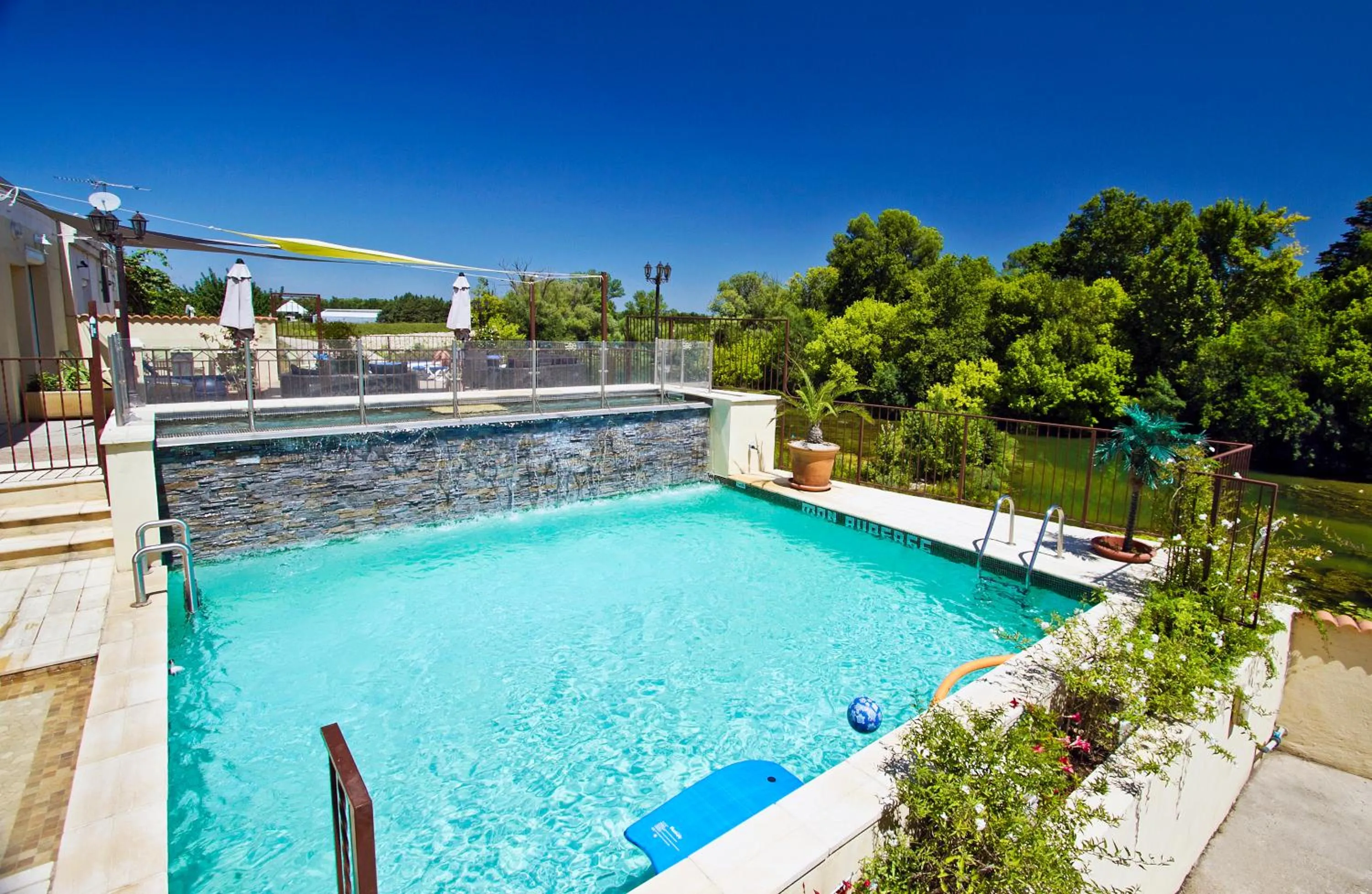 Swimming pool in Hôtel restaurant Mon Auberge