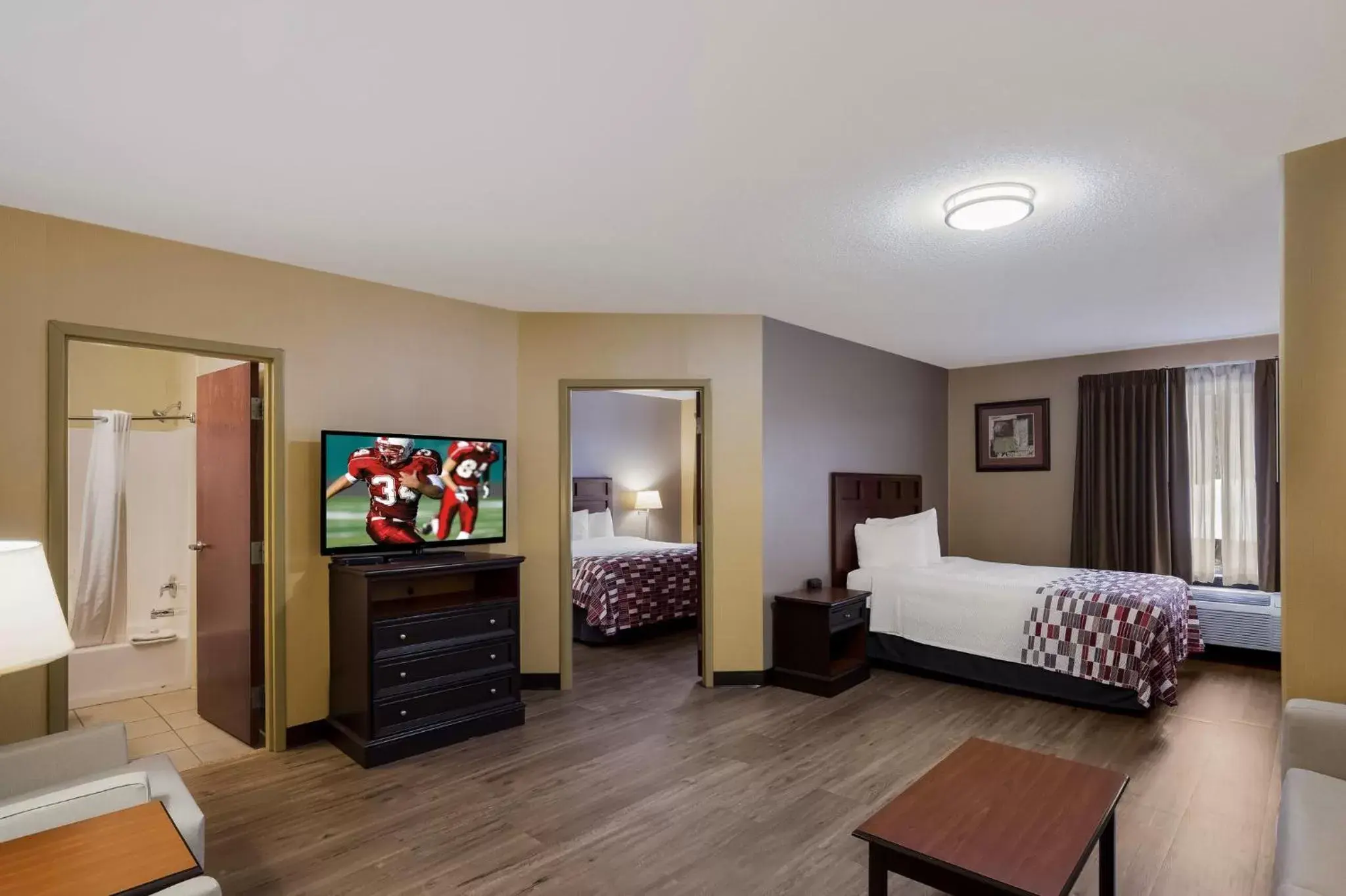 Photo of the whole room, TV/Entertainment Center in Red Roof Inn & Suites Bloomsburg - Mifflinville