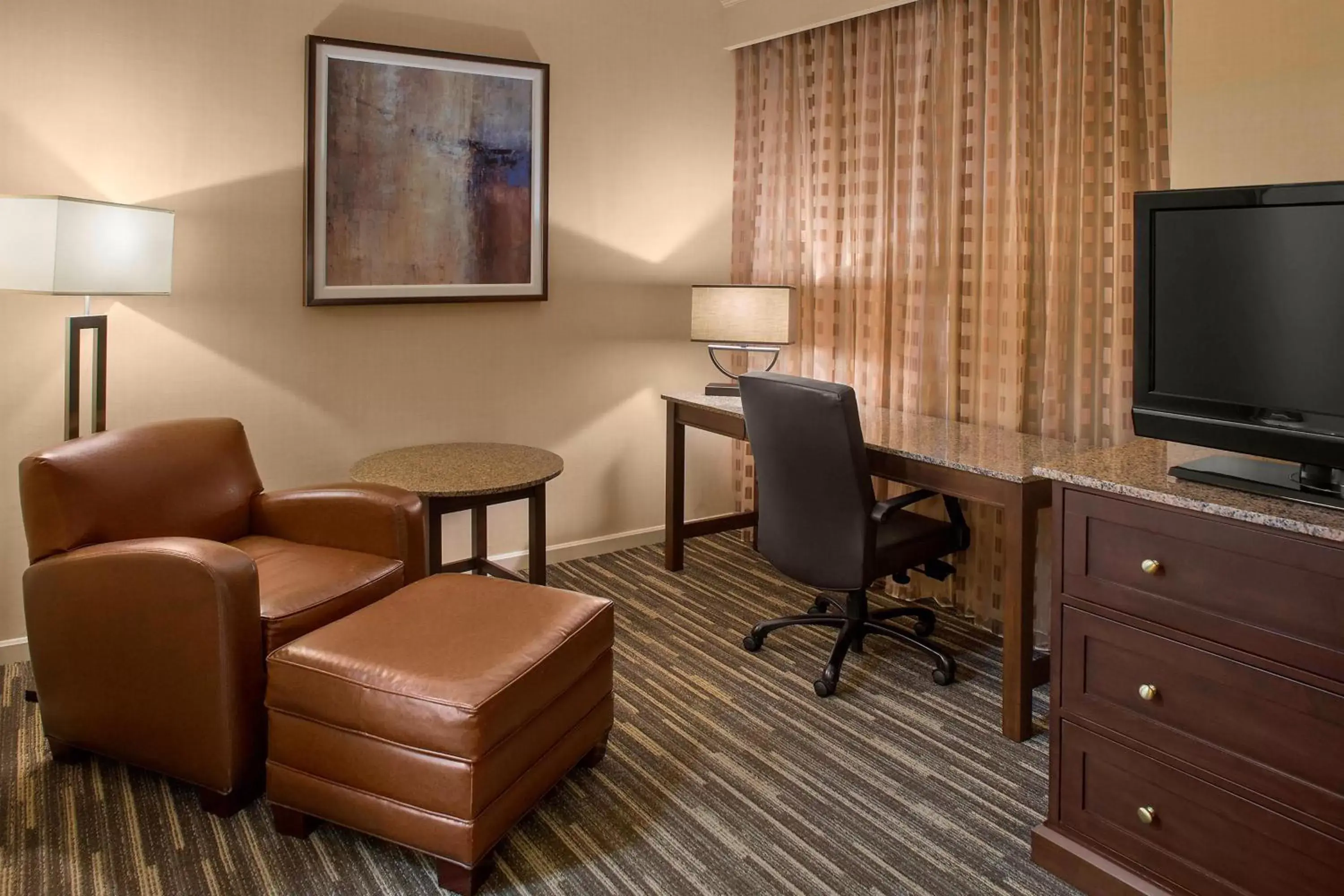 Photo of the whole room, TV/Entertainment Center in Sheraton Suites Akron Cuyahoga Falls