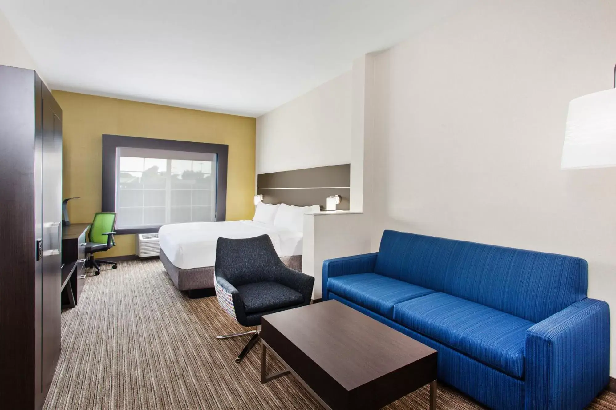 Bedroom, Seating Area in Holiday Inn Express & Suites Oakland - Airport, an IHG Hotel