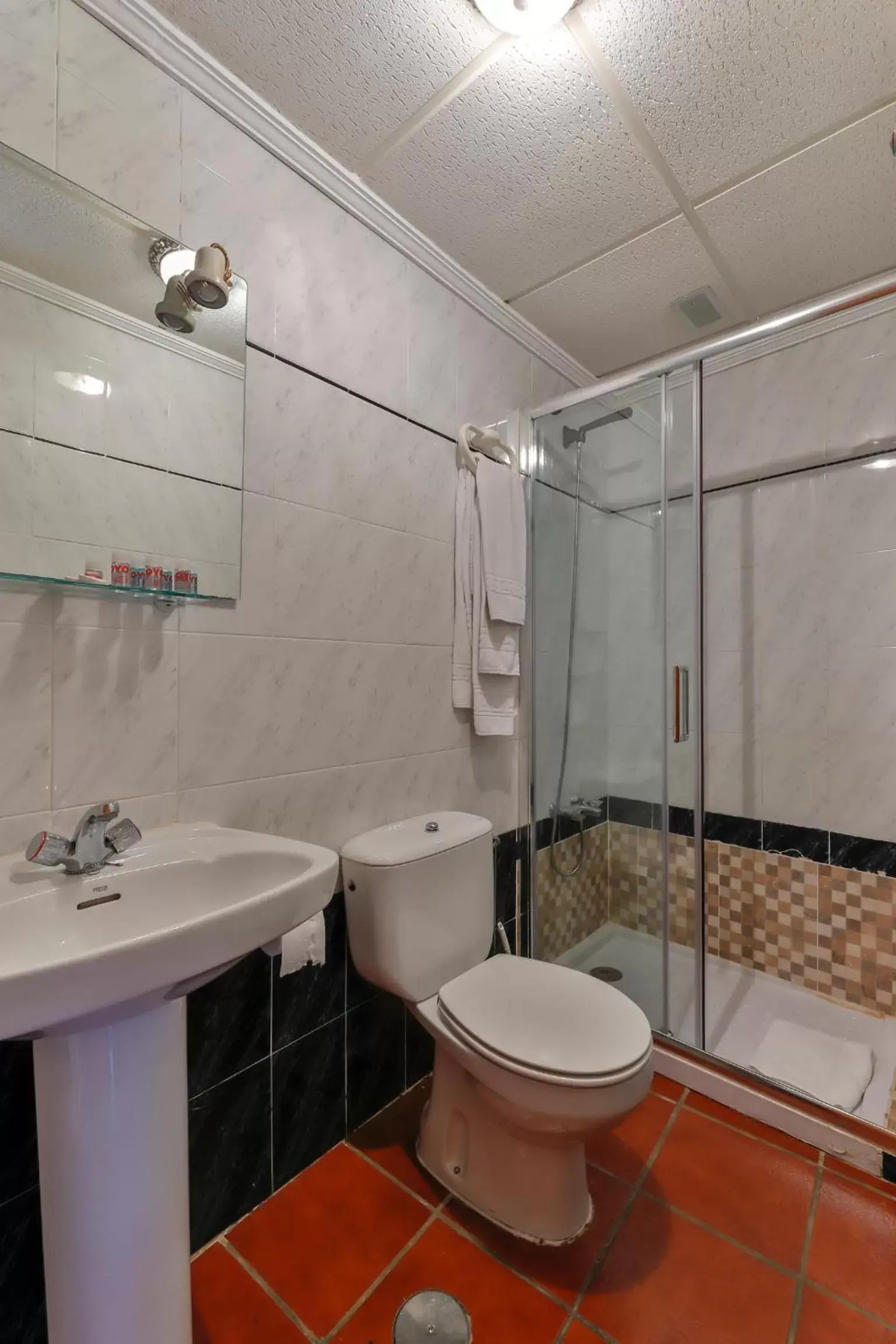 Bedroom, Bathroom in Hotel Las Palmeras by Vivere Stays