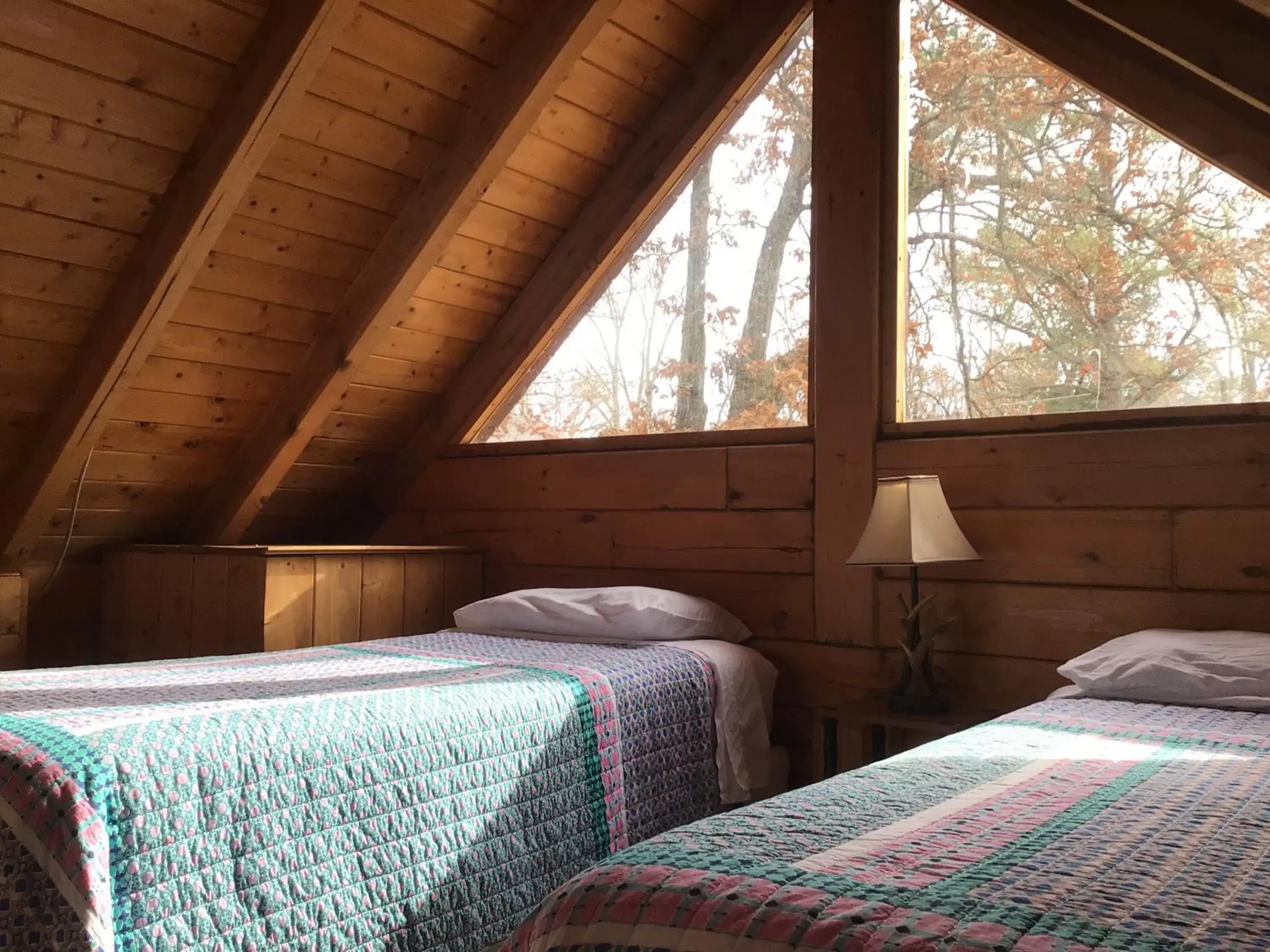 Bed in Kozy Haven Log Cabin Rentals