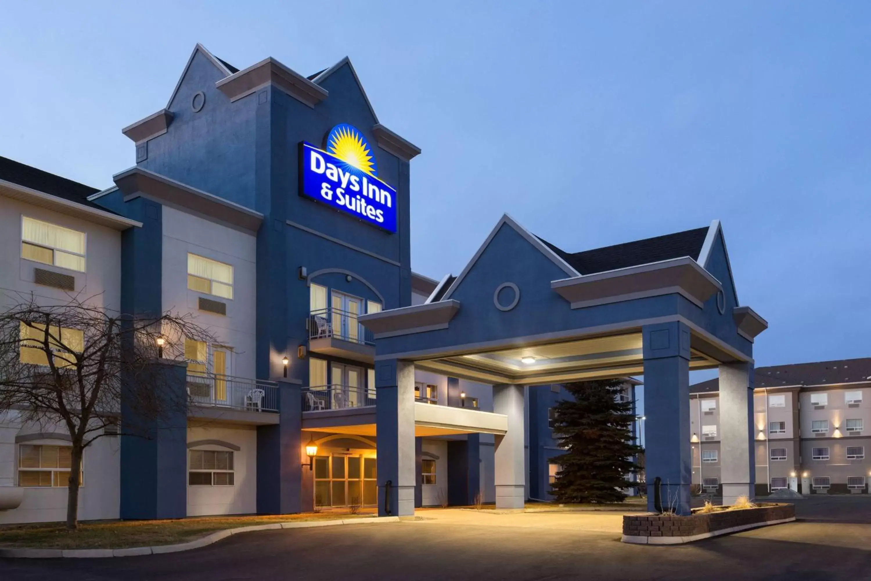 Property building in Days Inn & Suites by Wyndham Brooks