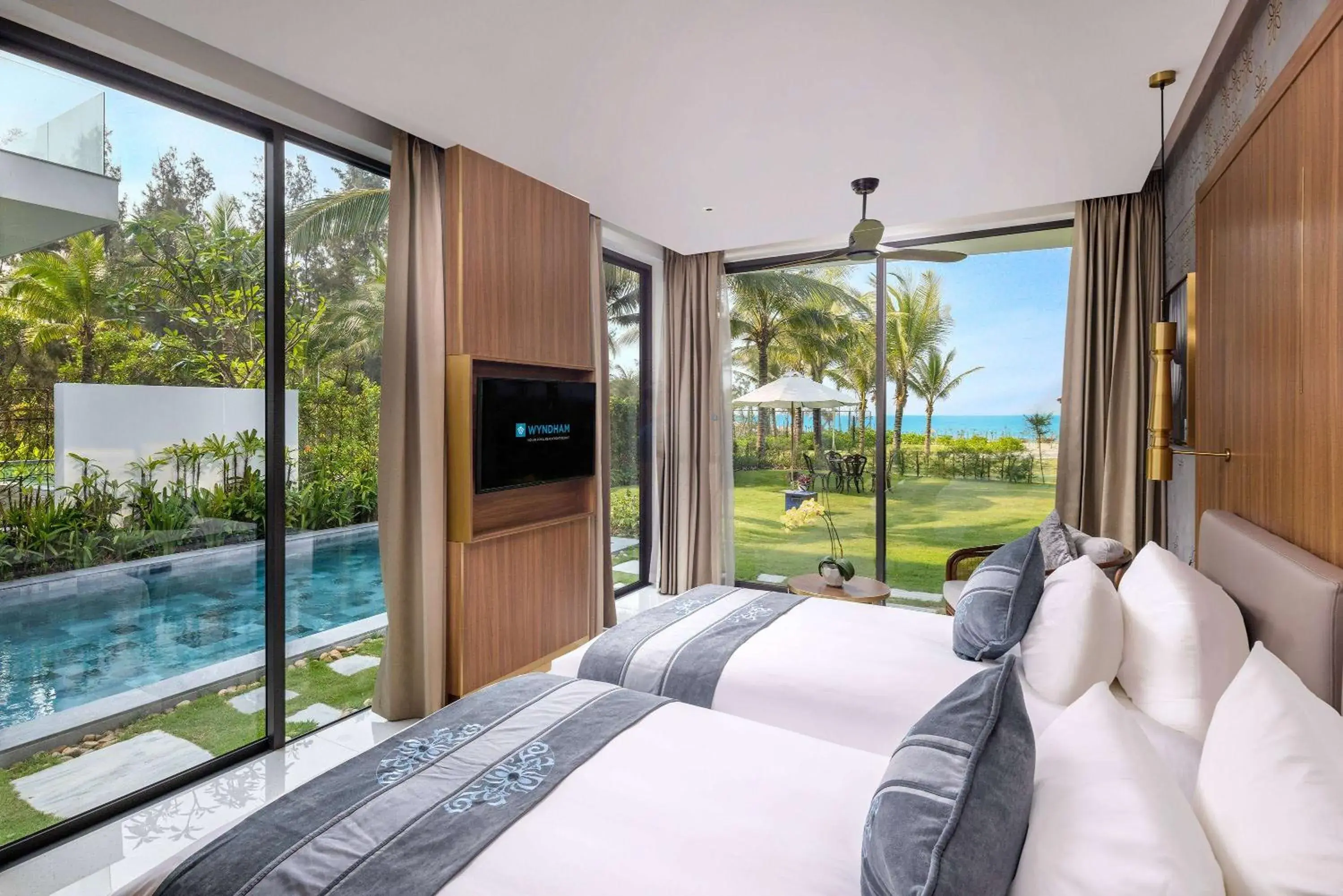 Bed, Pool View in Wyndham Hoi An Royal Beachfront Resort