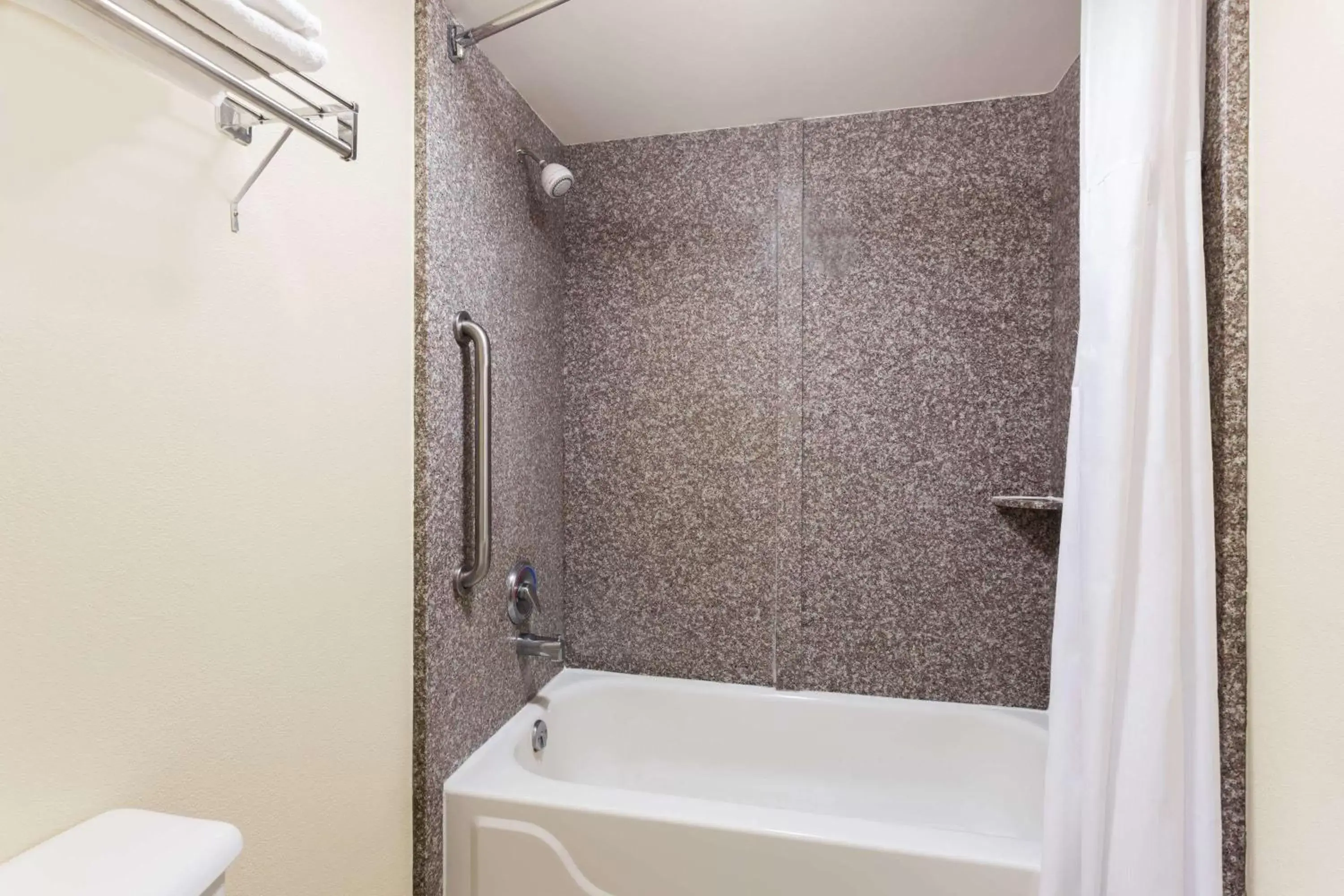 Bathroom in Days Inn & Suites by Wyndham Warner Robins Near Robins AFB
