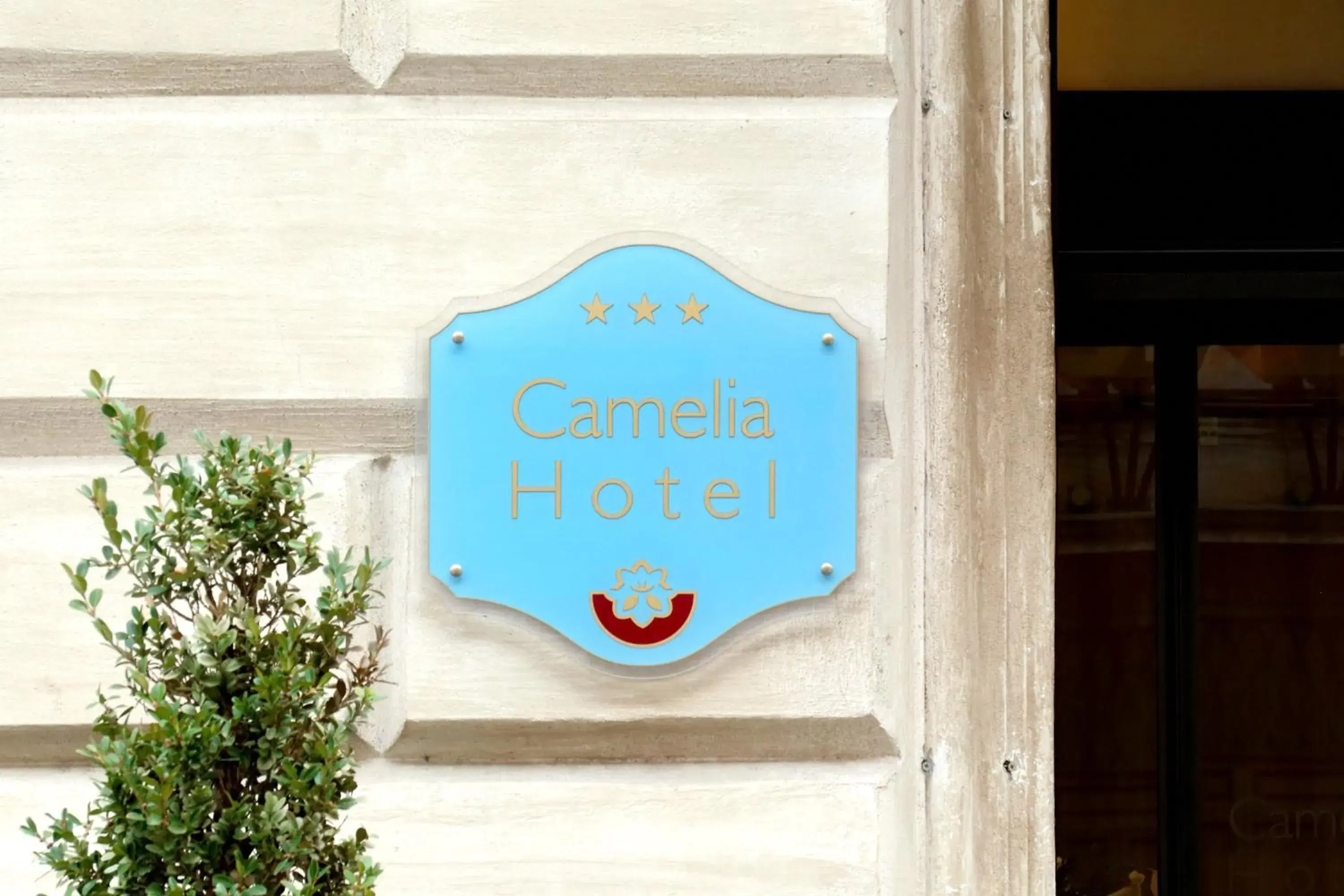 Property logo or sign in Hotel Camelia