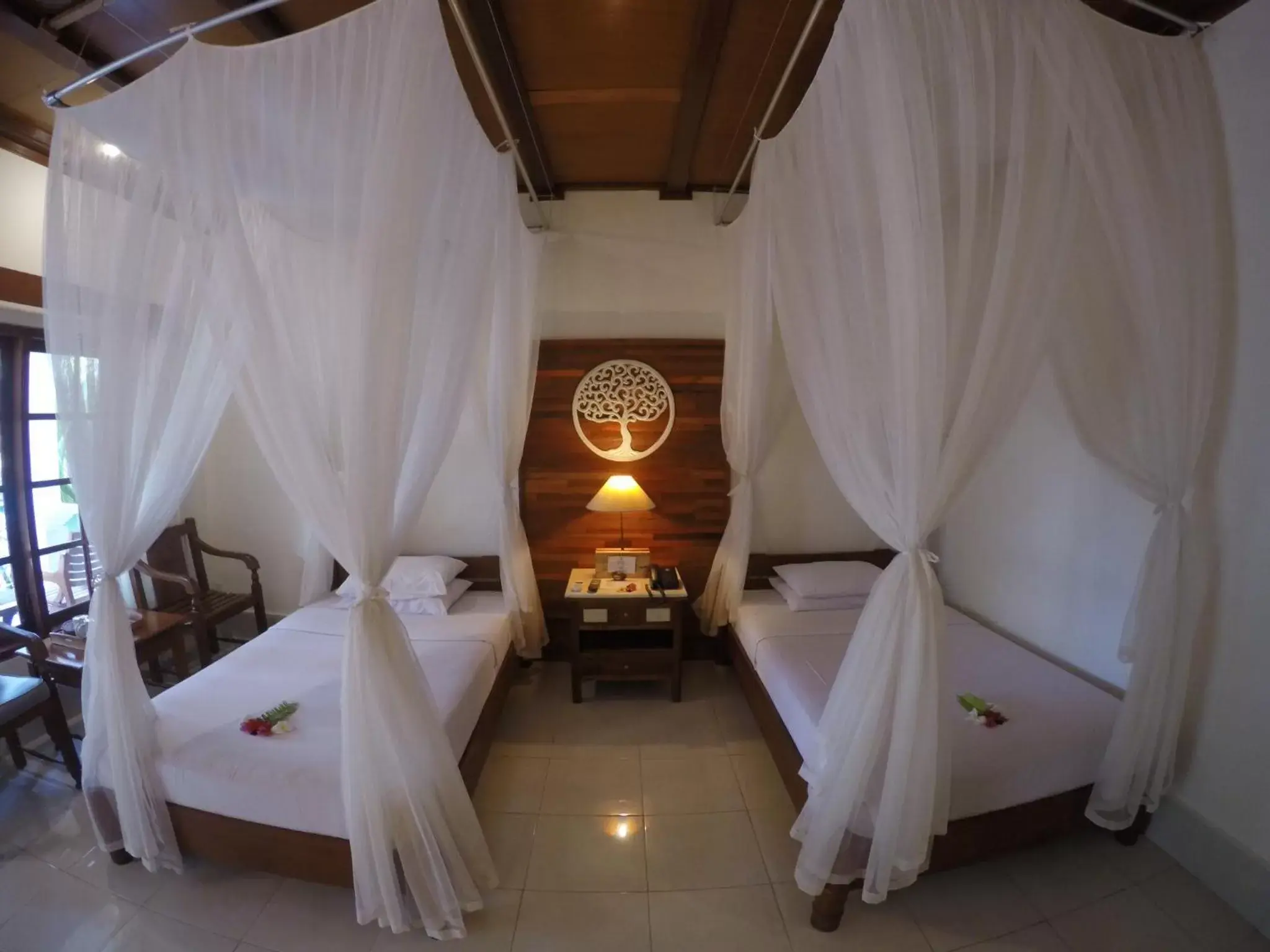 Photo of the whole room, Bed in Bumi Ayu Bungalow Sanur Photo of the whole room, Bed in Bumi Ayu Bungalow Sanur