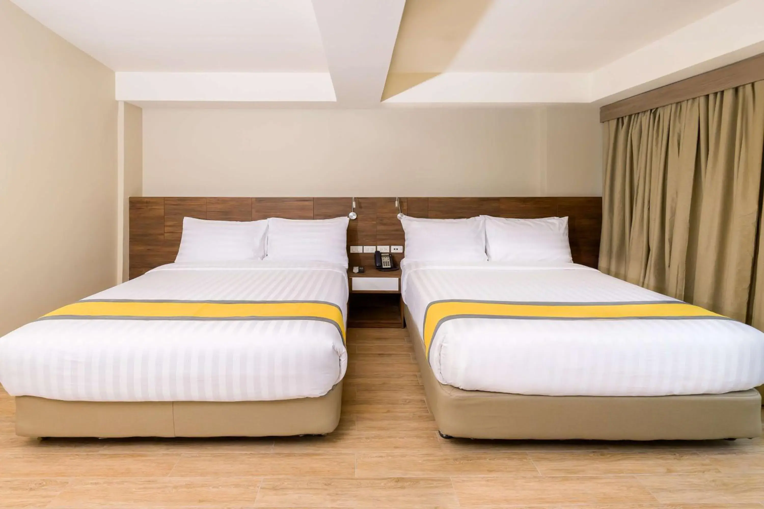 Photo of the whole room, Bed in SureStay Plus by Best Western Cebu City