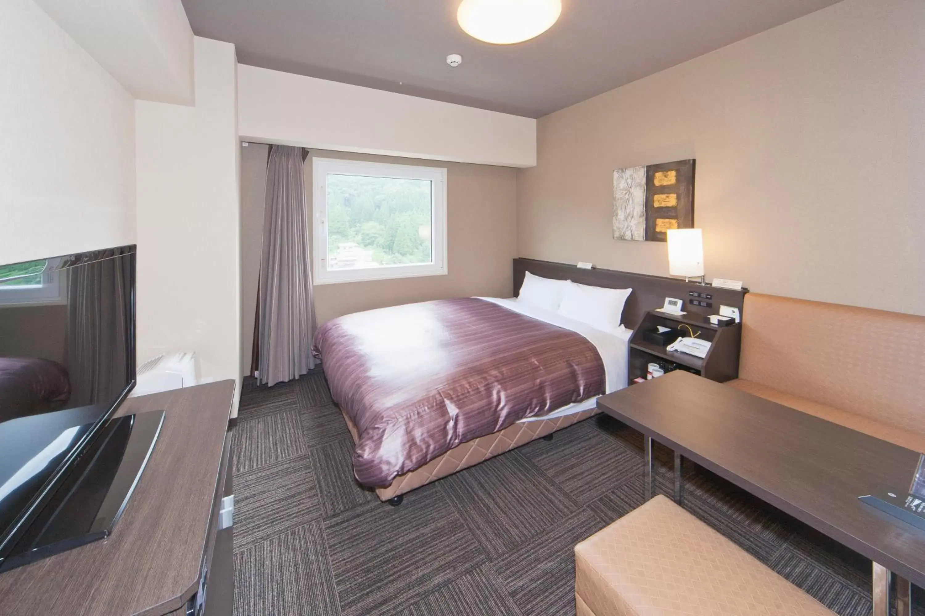 Photo of the whole room, Bed in Hotel Route-Inn Saiki Ekimae