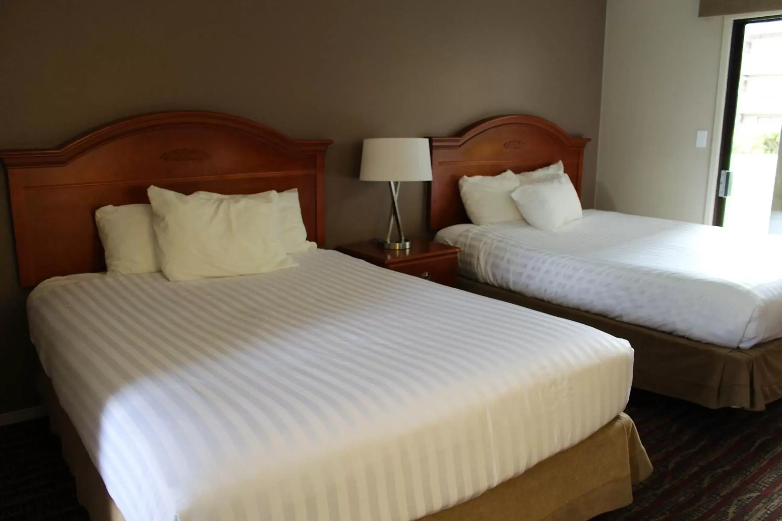 Bed in Ramada by Wyndham Campbell River