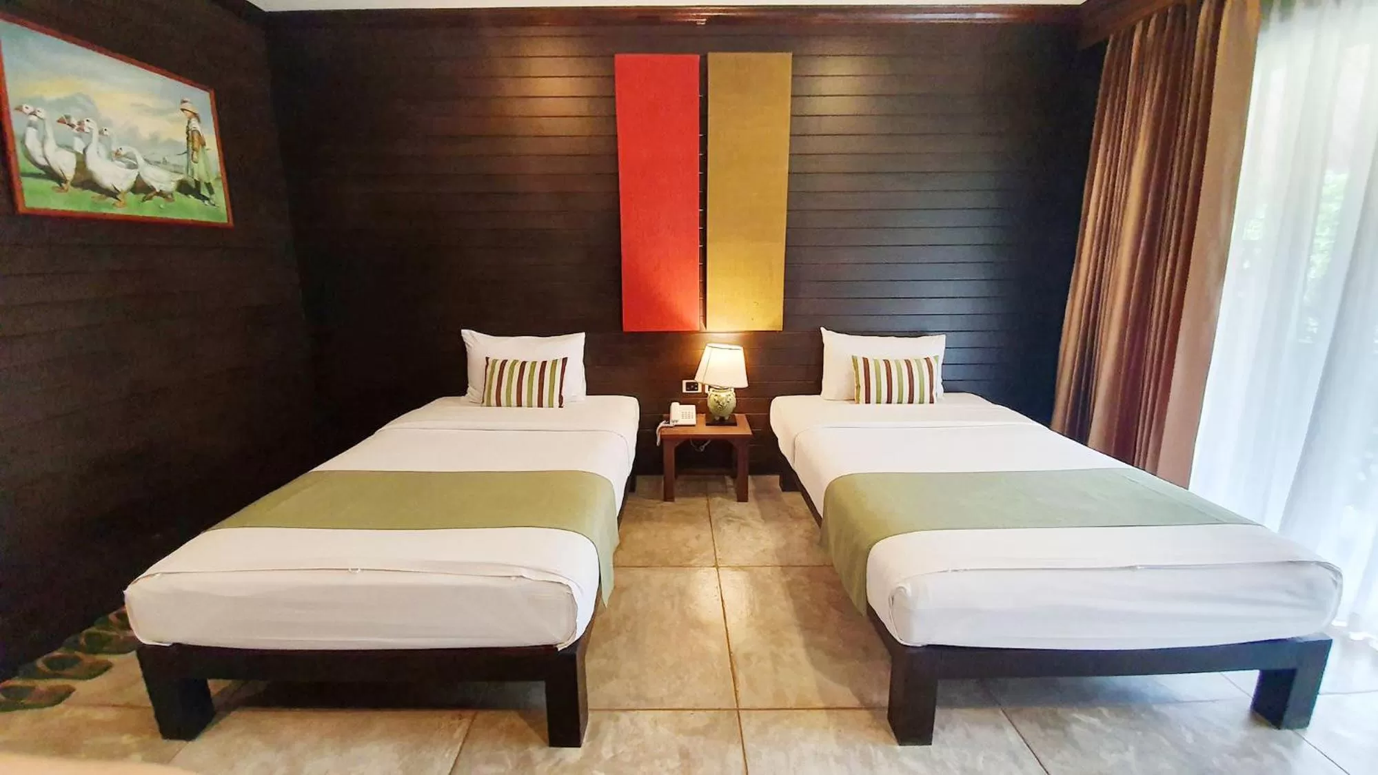 Bed in Royal River Kwai Resort and Spa