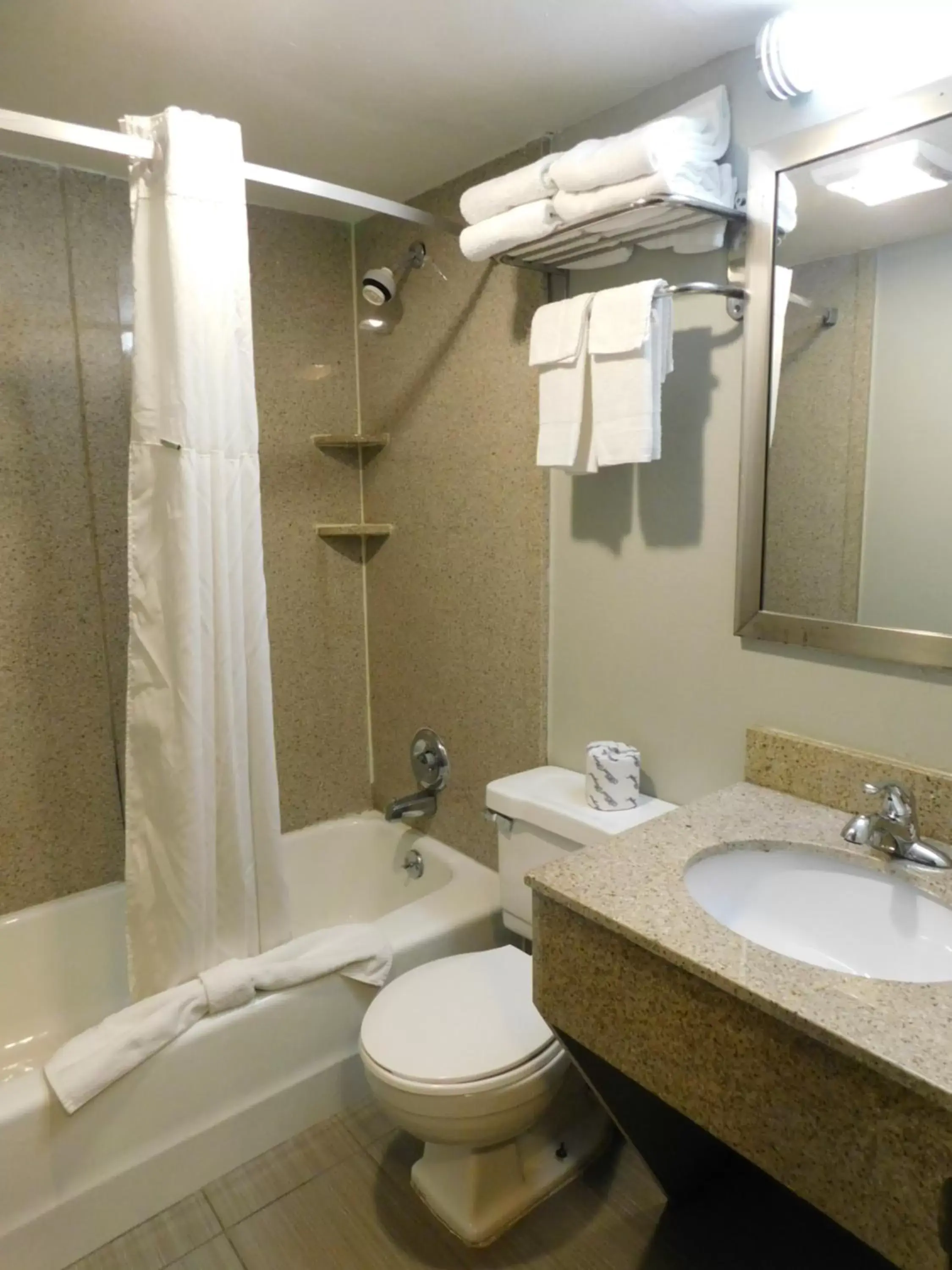 Bathroom in Days Inn & Suites by Wyndham Downtown Gatlinburg Parkway