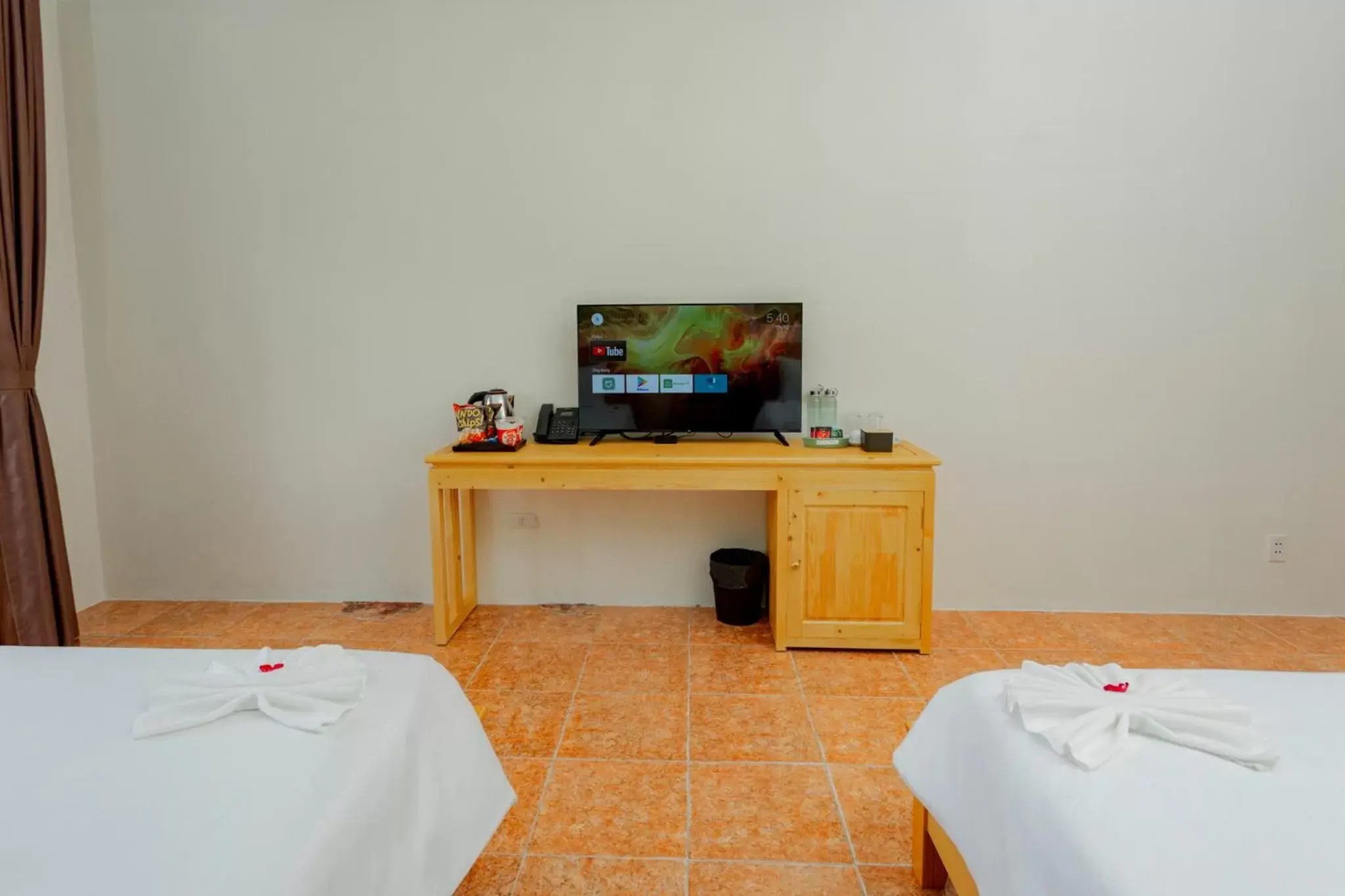 Photo of the whole room, Bed in Sea and Sand Hotel