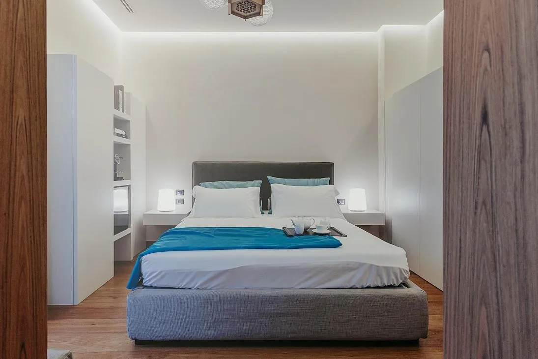 Bed in Bacã Suites, Restaurant & Bar