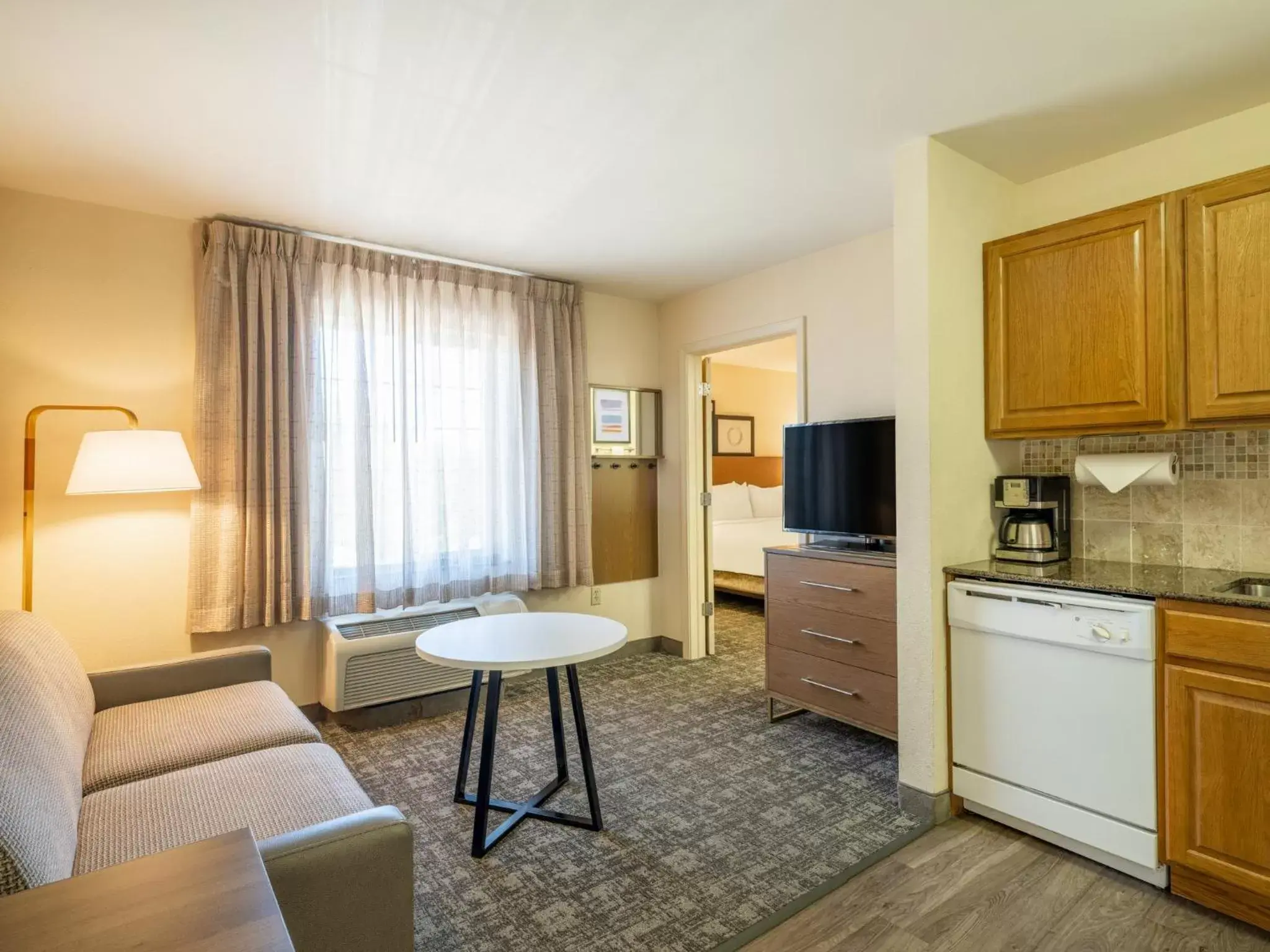 Bedroom, Seating Area in Staybridge Suites Milwaukee Airport South, an IHG Hotel