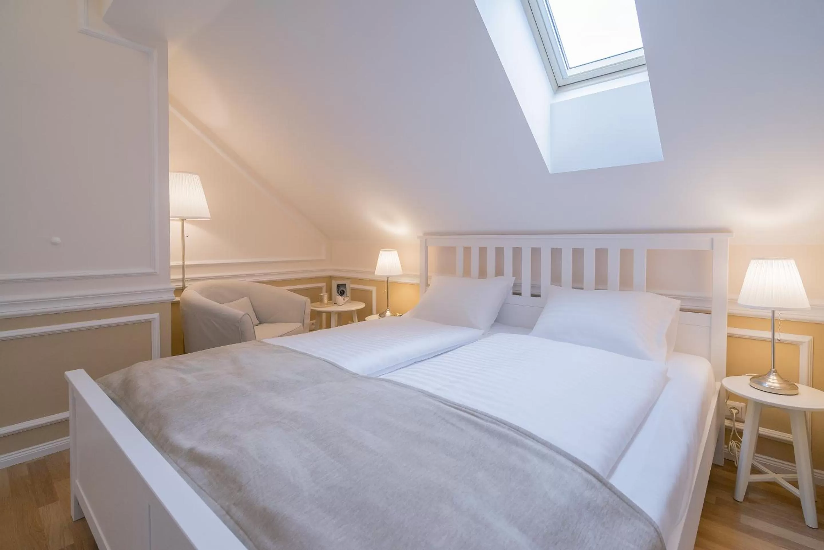 Seating area, Bed in Revelton Suites Karlovy Vary