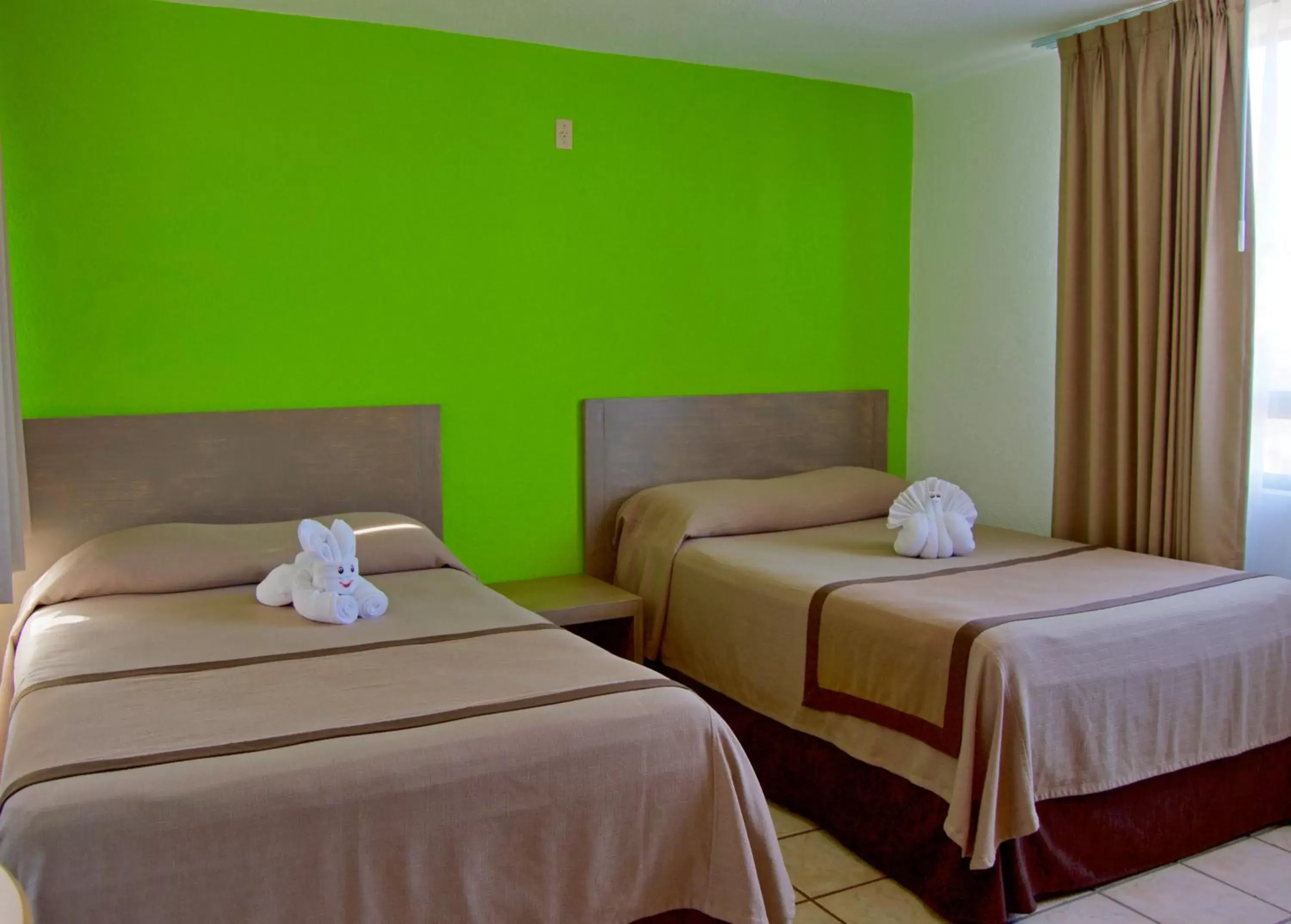 Bed in Sunrock Hotel & Suites