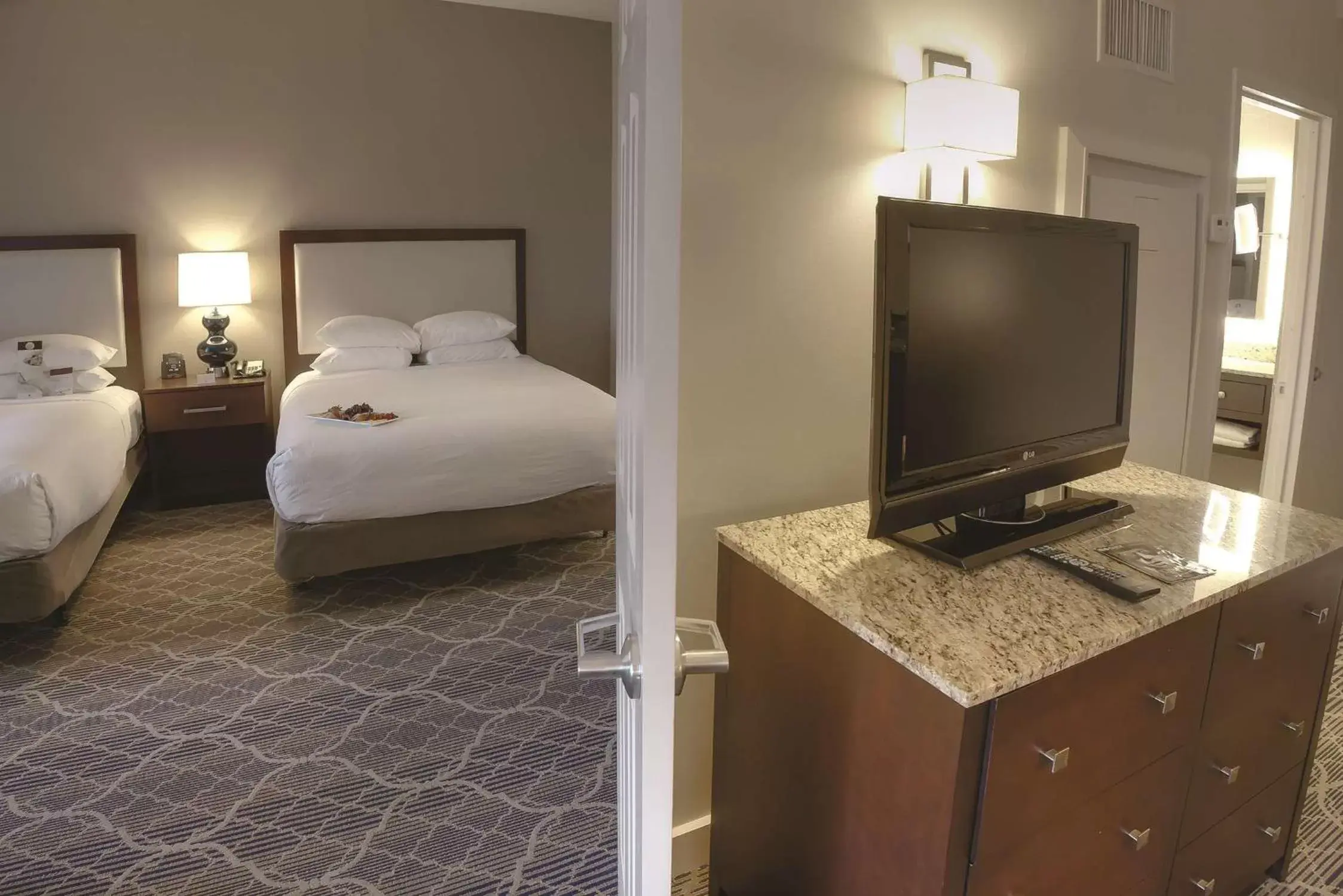 Bedroom, TV/Entertainment Center in Doubletree Suites by Hilton at The Battery Atlanta