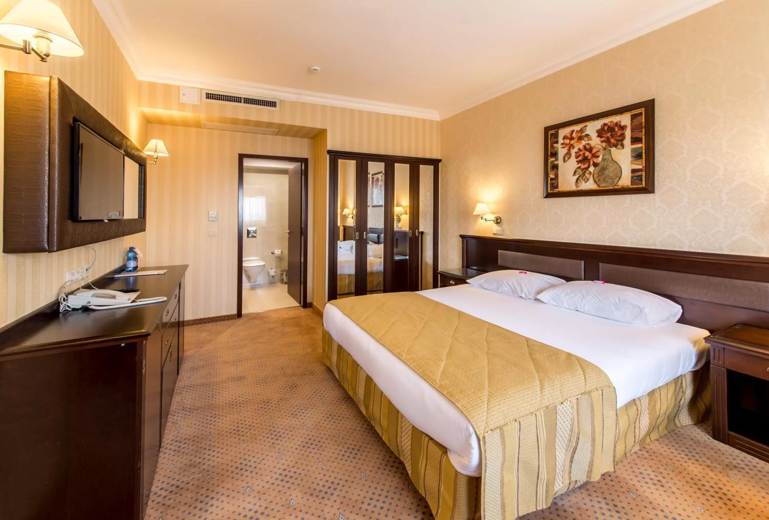 Bed in Ramada Hotel & Suites by Wyndham Bucharest North