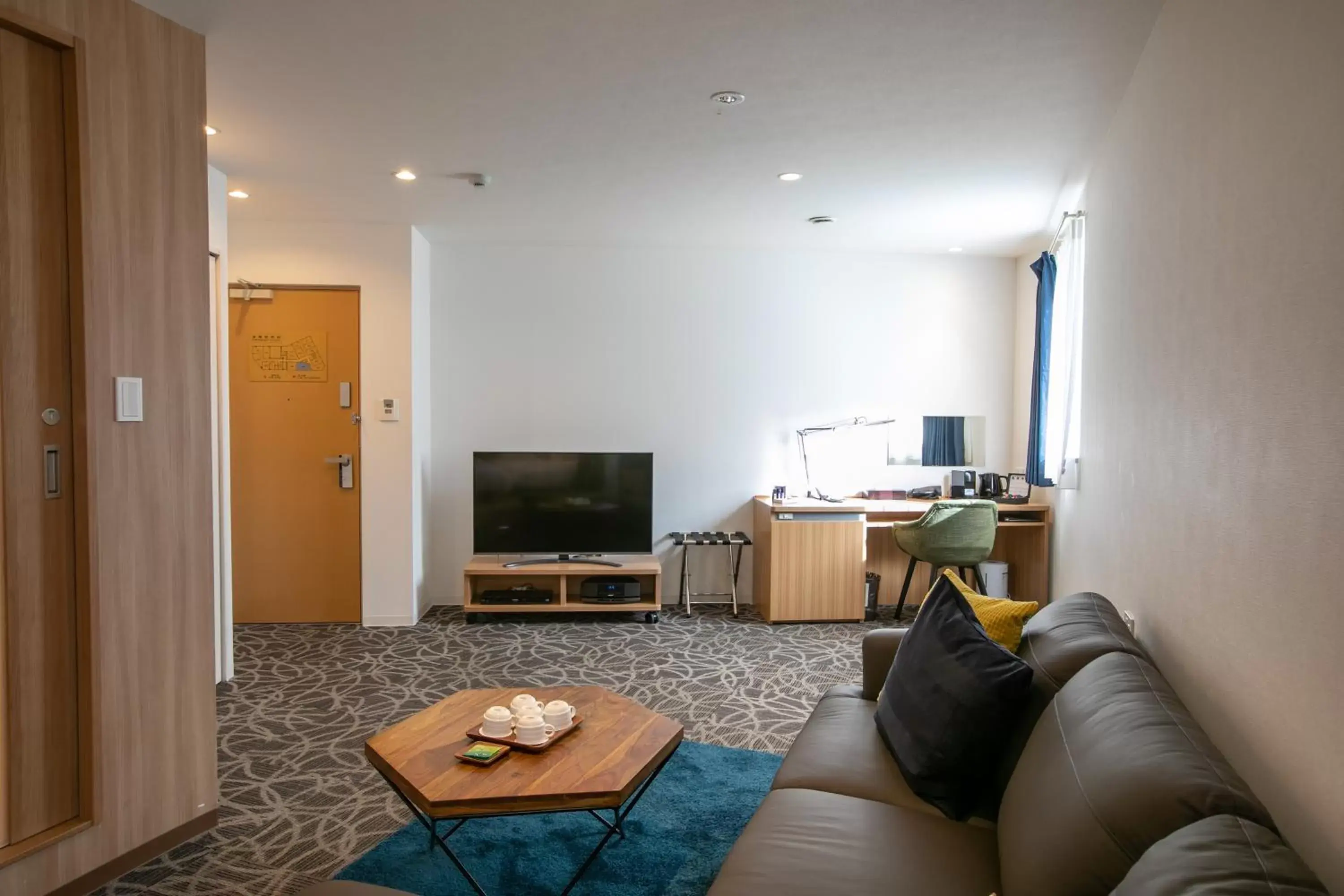 Photo of the whole room, Seating Area in Sakura Garden Hotel