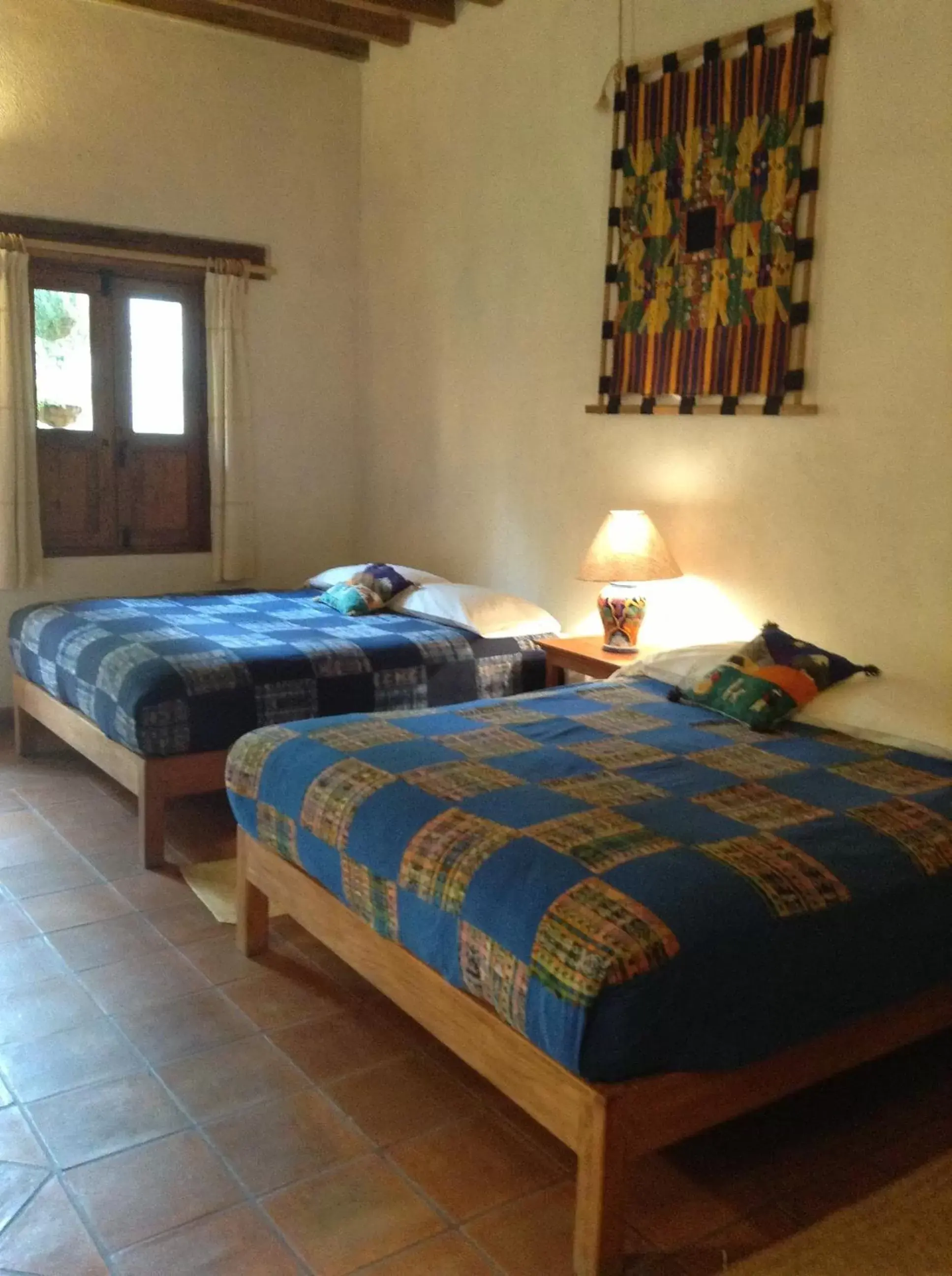 Photo of the whole room, Bed in Posada Yolihuani