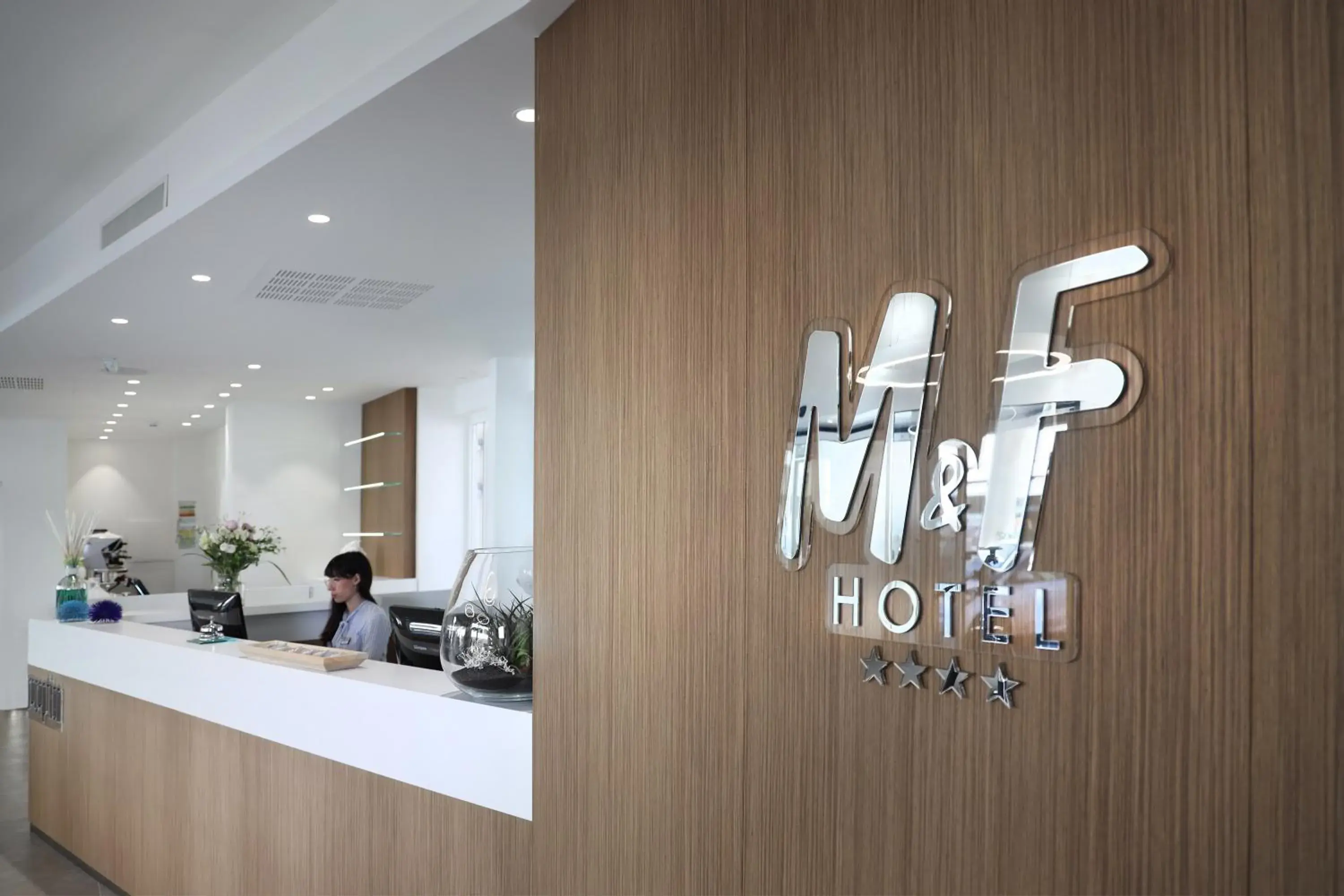 Property logo or sign in M&F Hotel