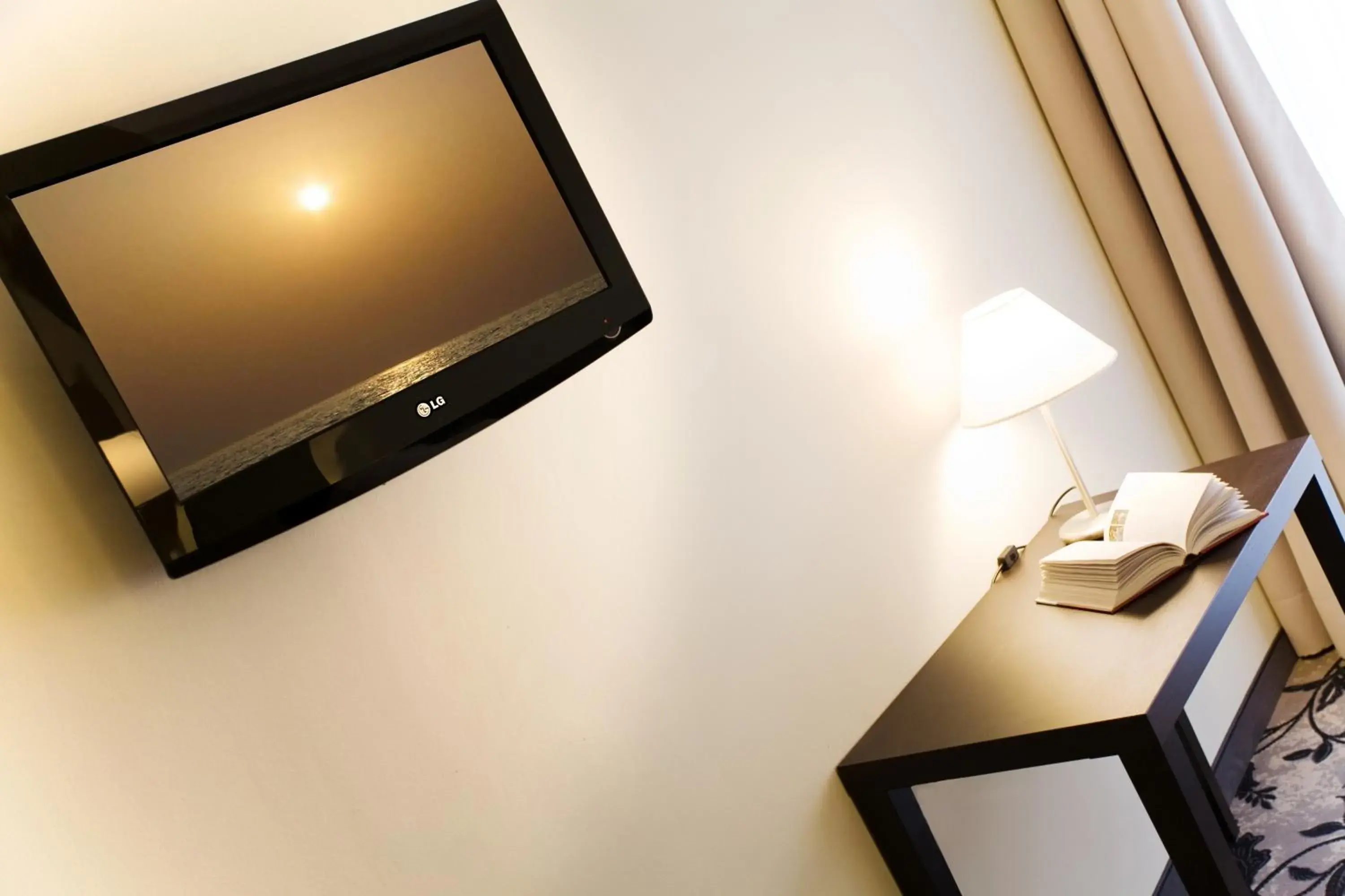 TV and multimedia, TV/Entertainment Center in Regal Hotel & Residence