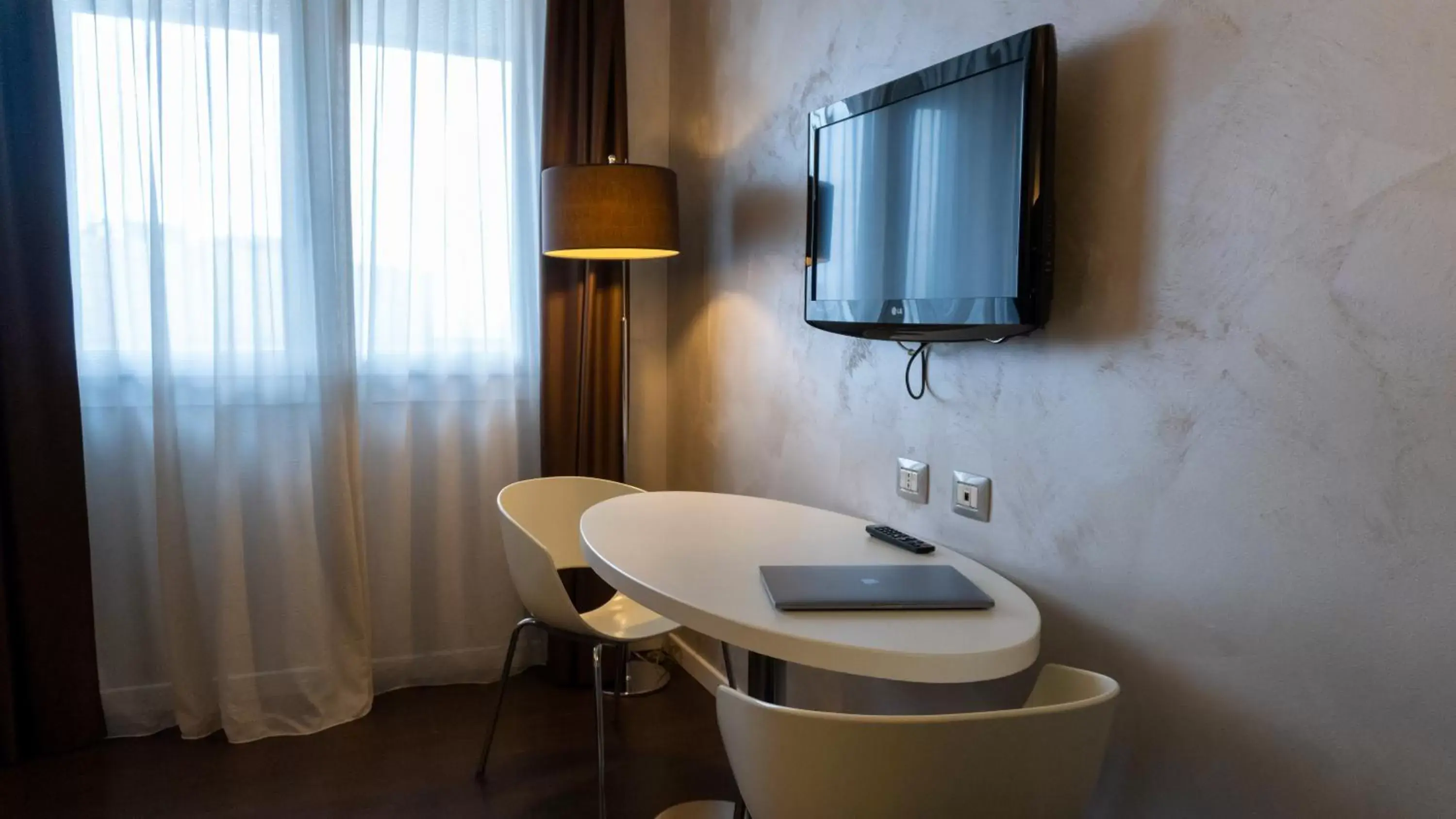 Seating area, TV/Entertainment Center in AMEDIA Hotel