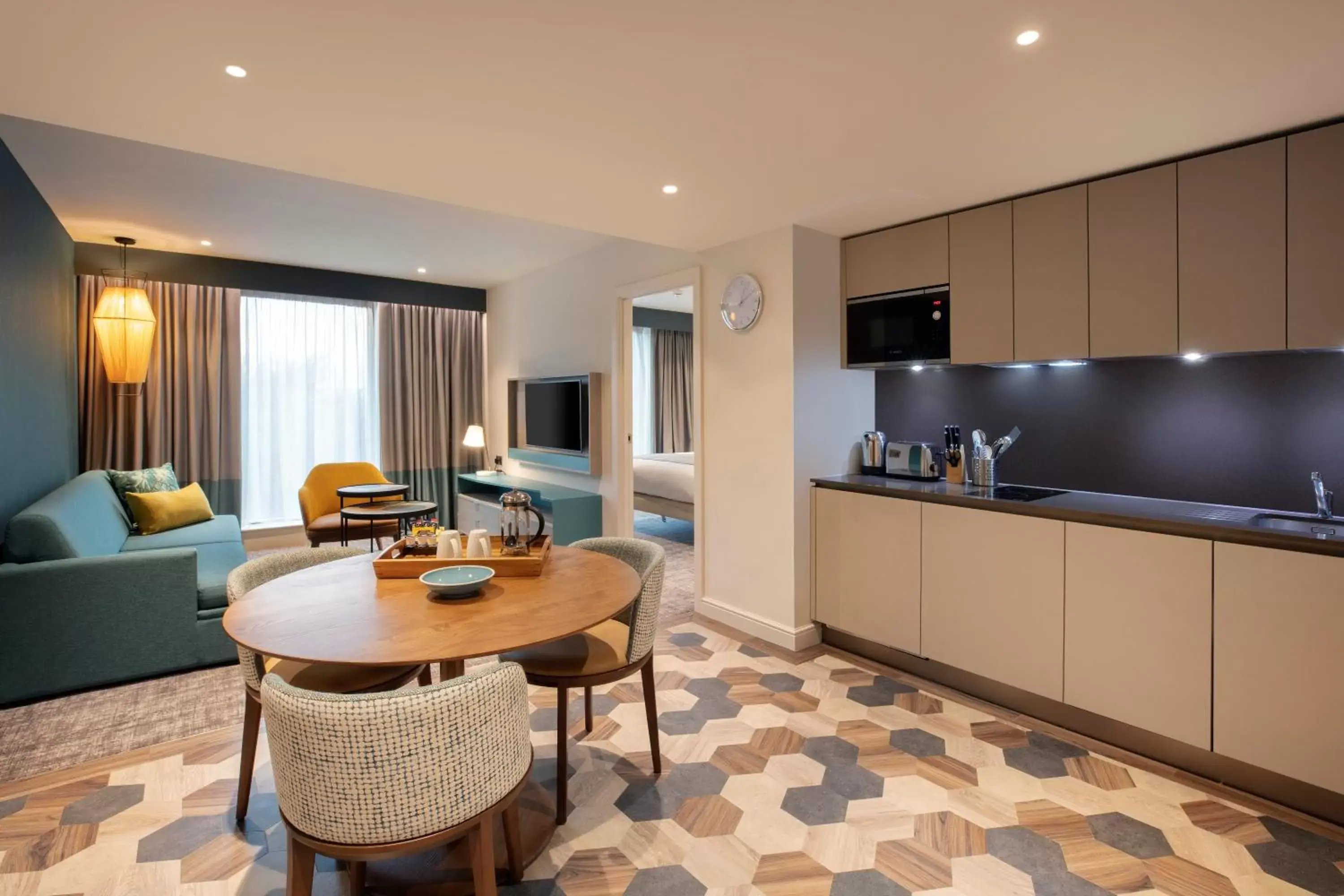 TV and multimedia, Kitchen/Kitchenette in Staybridge Suites London Heathrow - Bath Road, an IHG Aparthotel