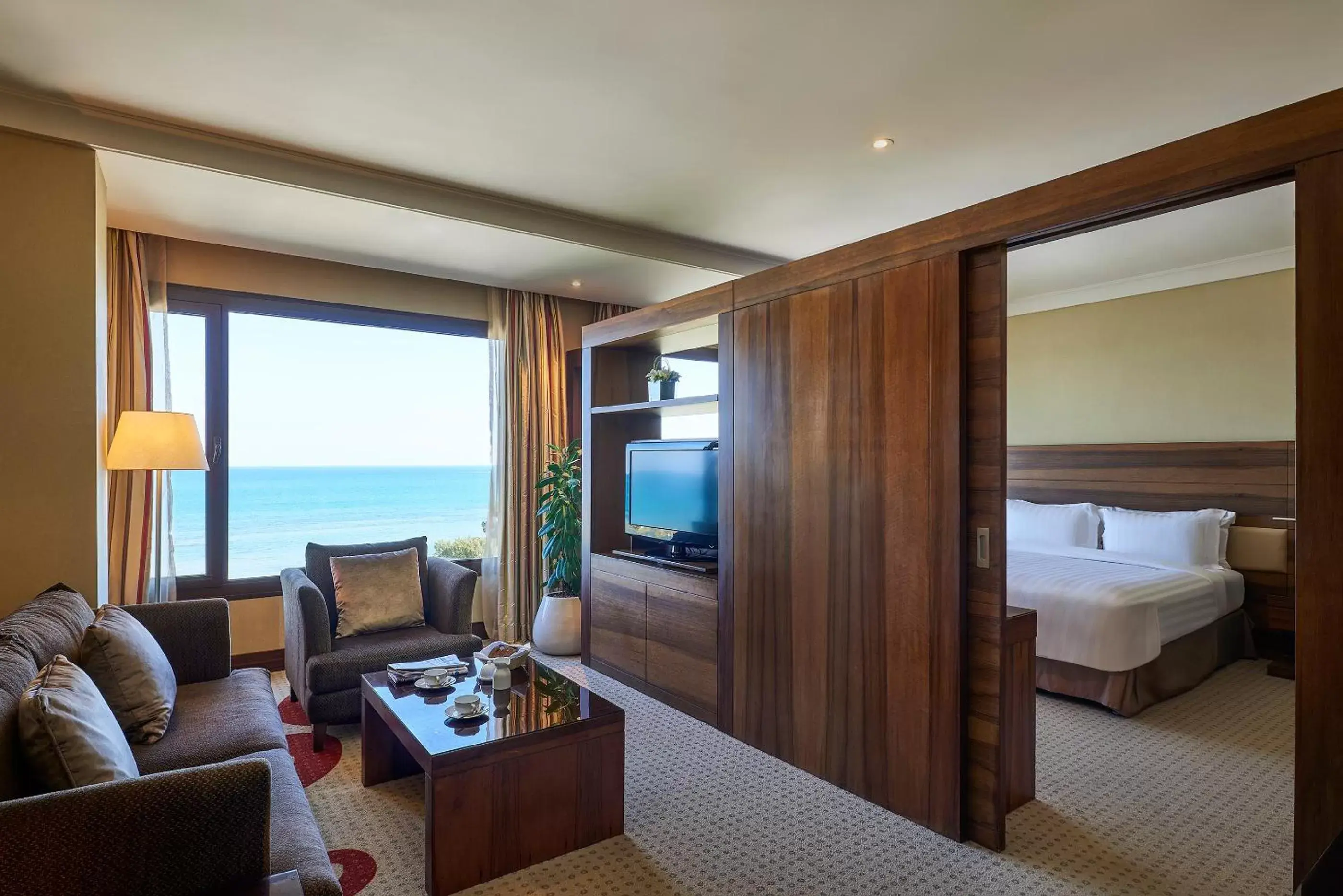 Seating area, Bed in Safir Fintas Hotel Kuwait Seating area, Bed in Safir Fintas Hotel Kuwait