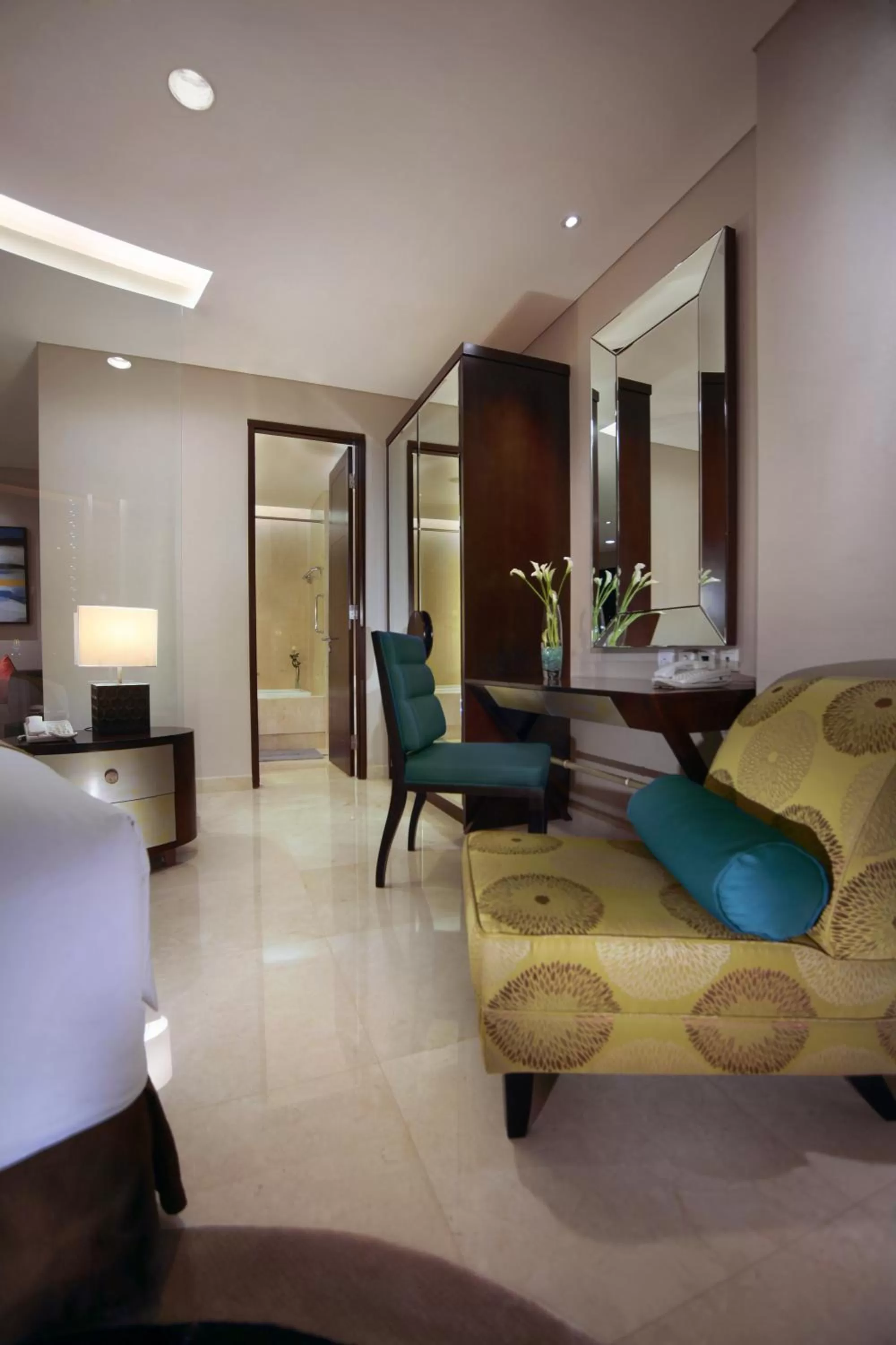 Seating area, Bed in The Grove Suites by Grand Aston