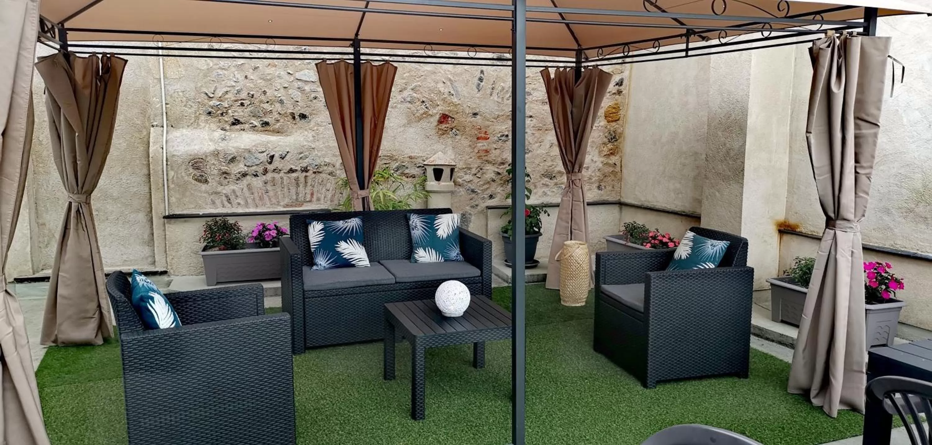 Patio in Logis Hotel La Tourelle du Beffroi