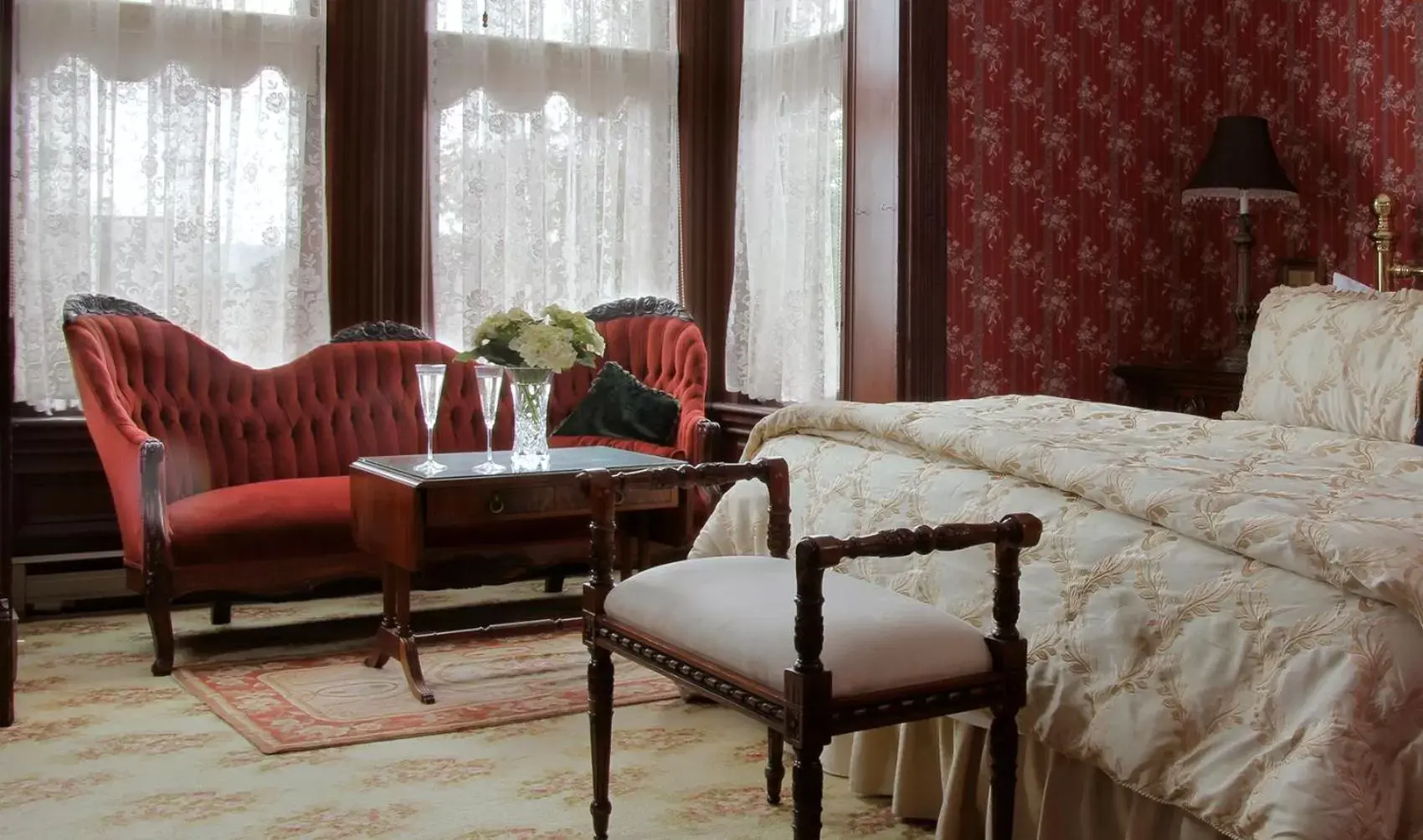 Bed, Seating Area in Victorian Inn