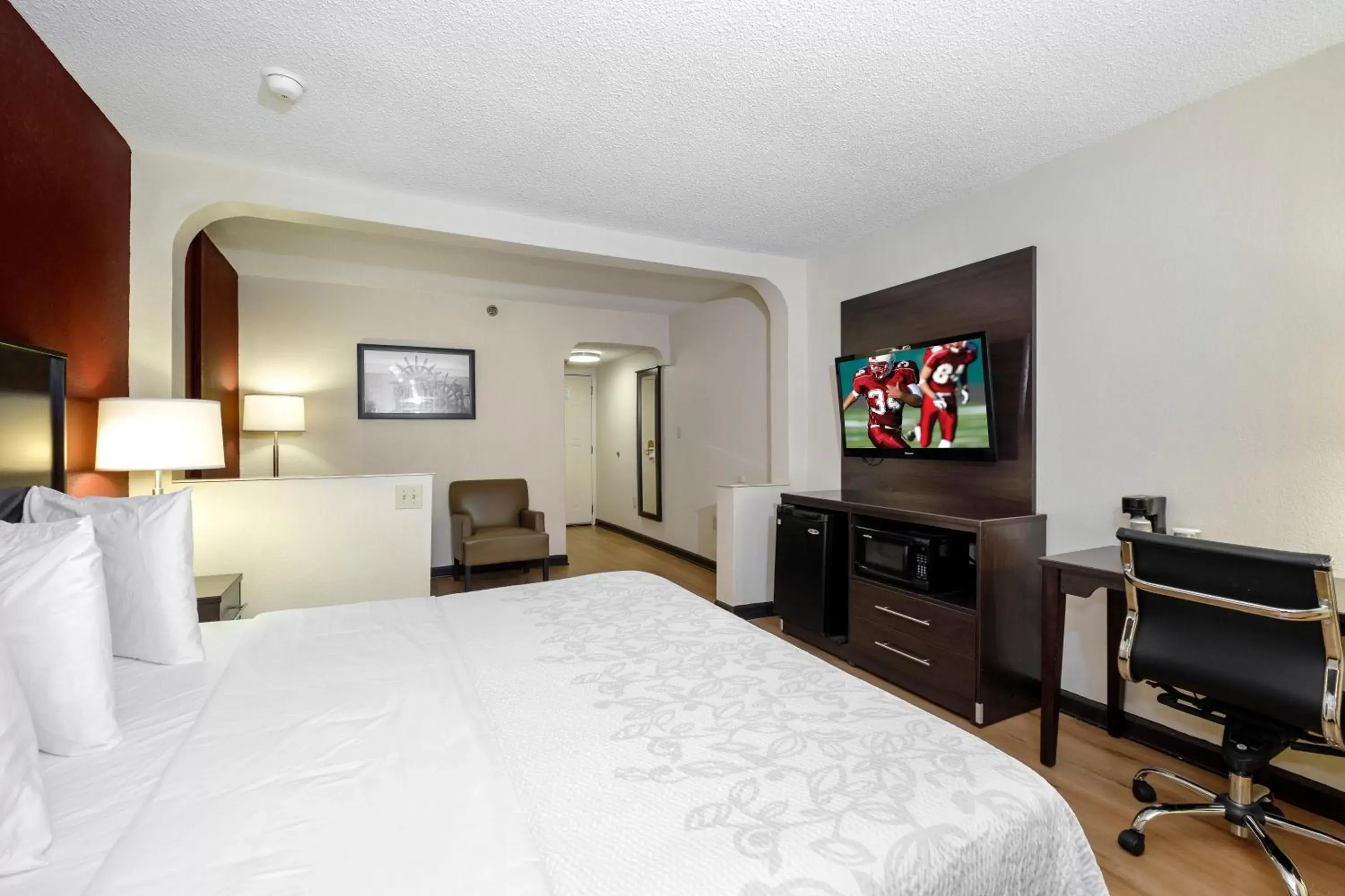 Photo of the whole room, TV/Entertainment Center in Red Roof Inn PLUS+ & Suites Opelika