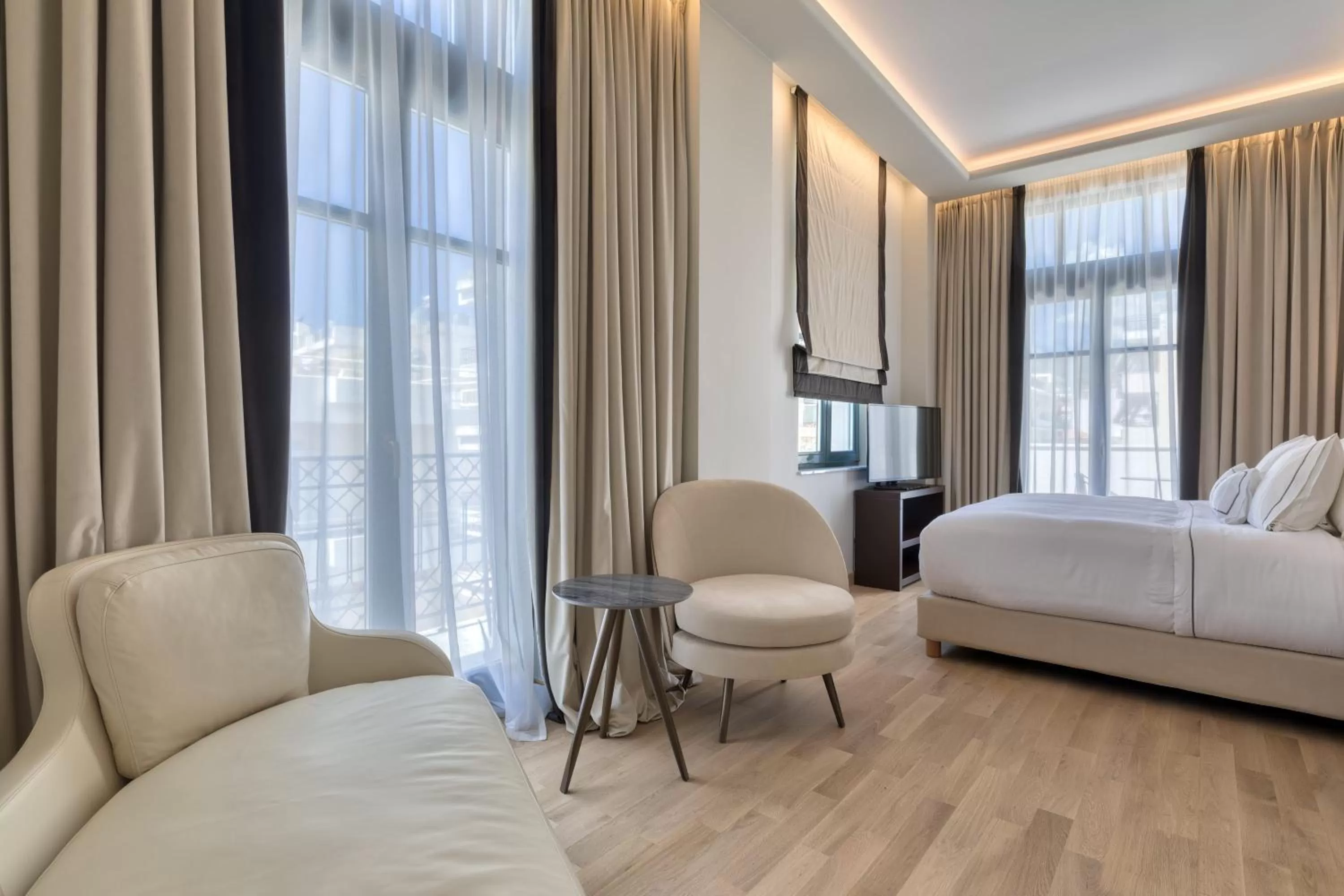 Seating area, Bed in Grand Hotel Kalamata