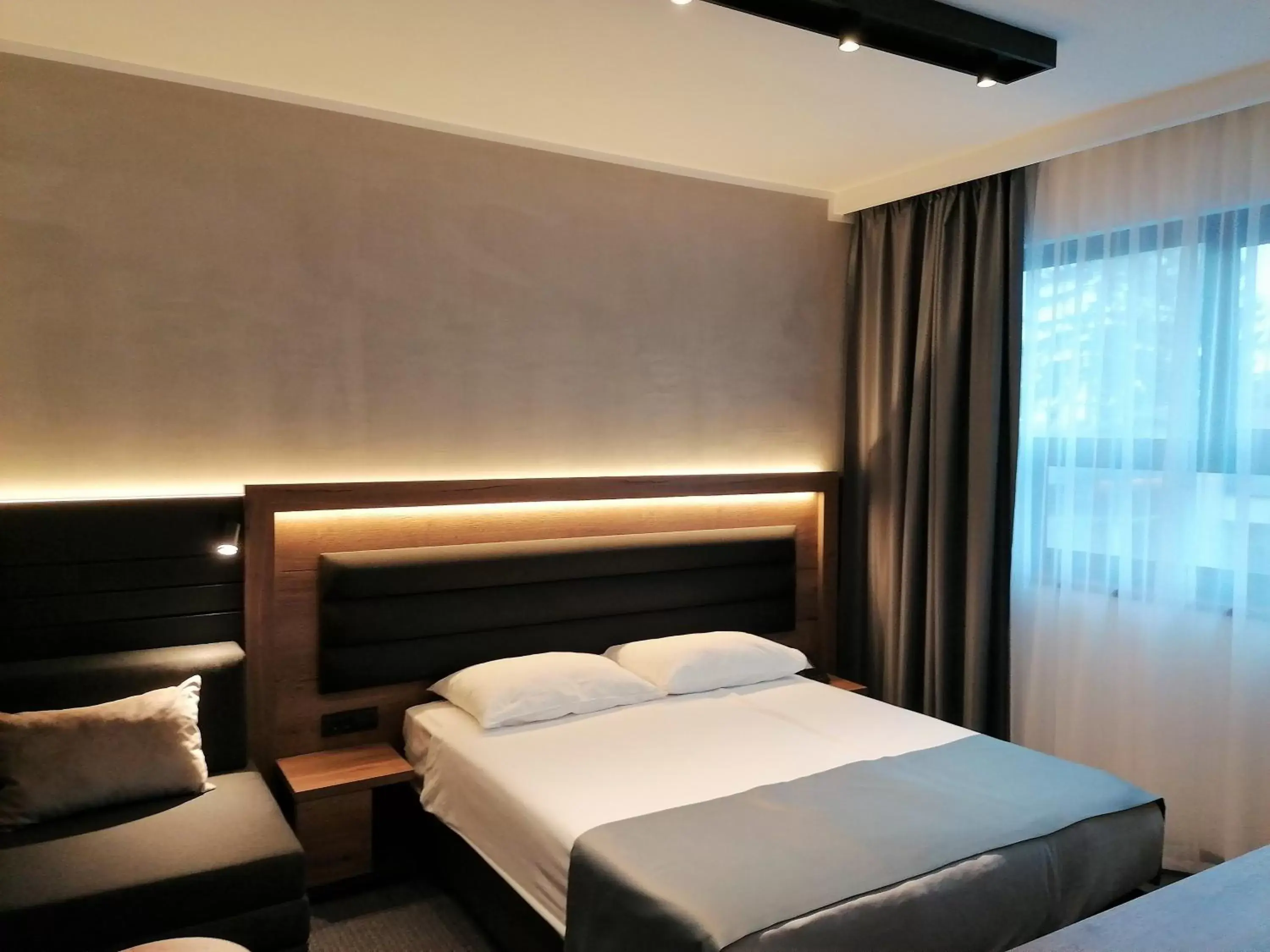 Bed in Hotel Aristos
