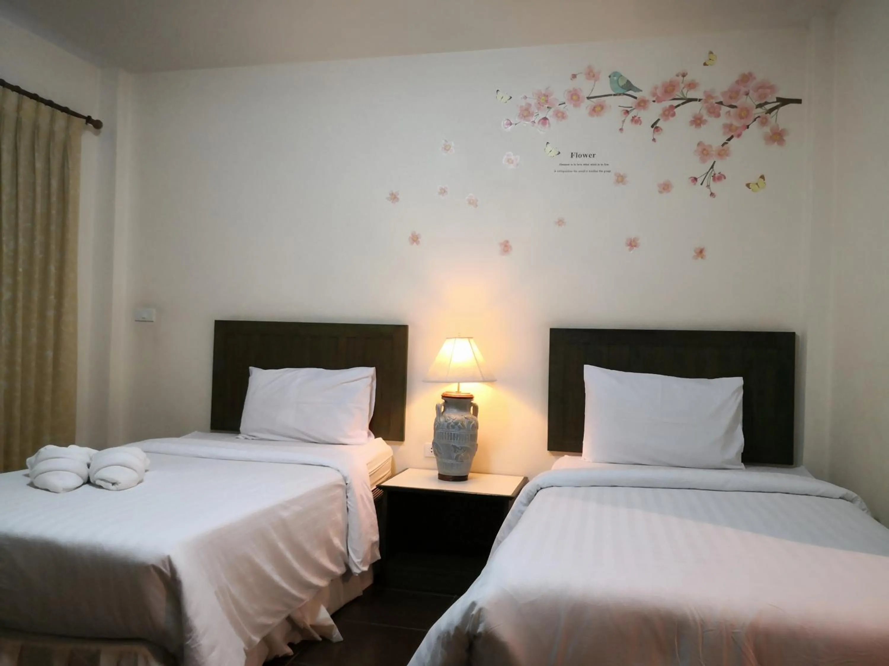 Bed in Baan Suksiri Hotel