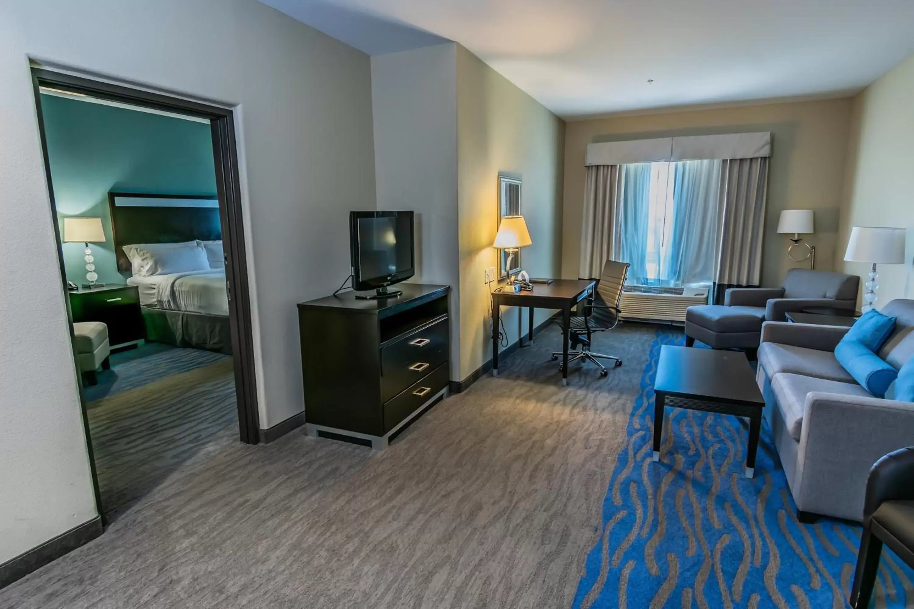 Photo of the whole room, TV/Entertainment Center in Holiday Inn Houston-Webster, an IHG Hotel