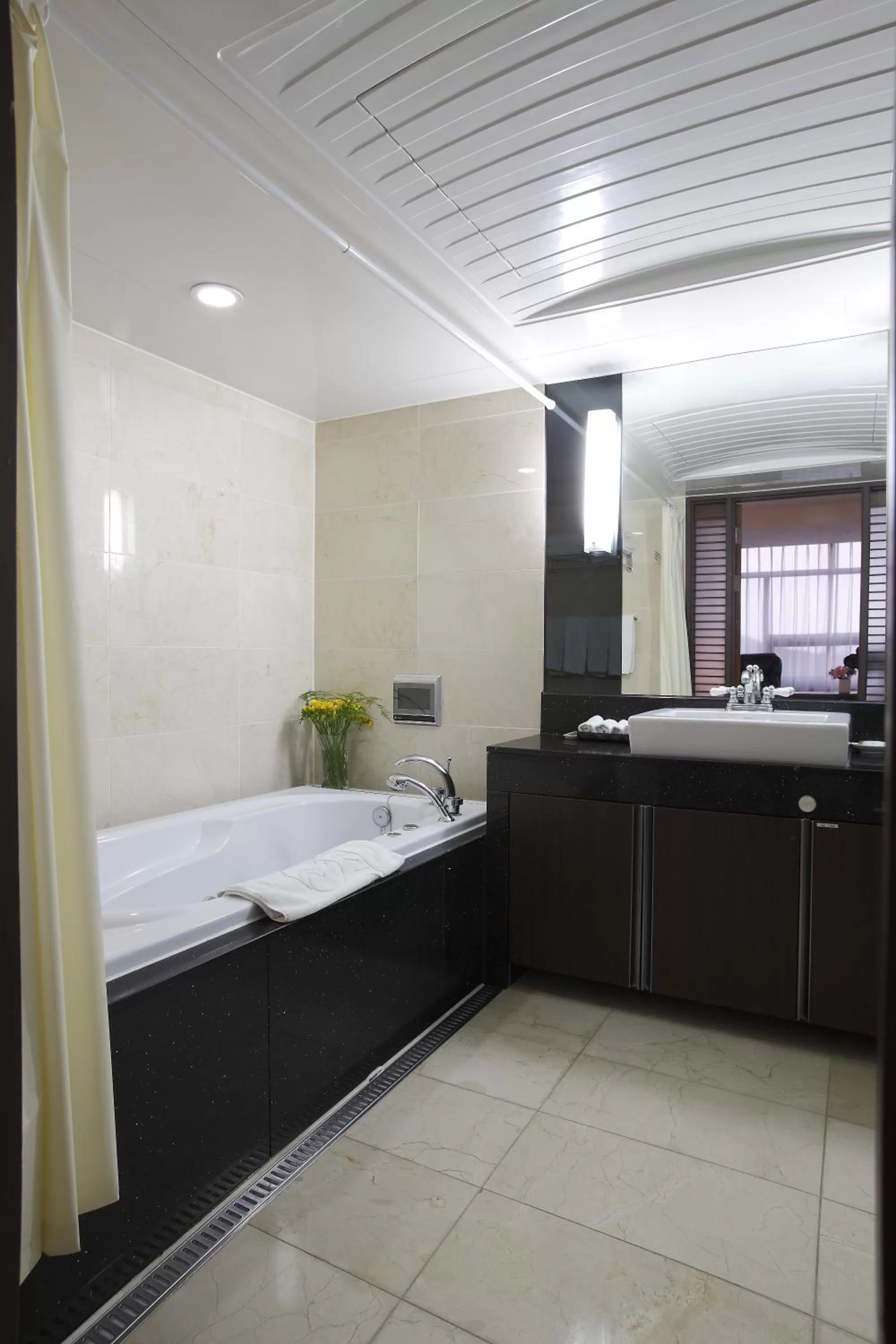 Bathroom, Bed in Ramada by Wyndham Dongtan