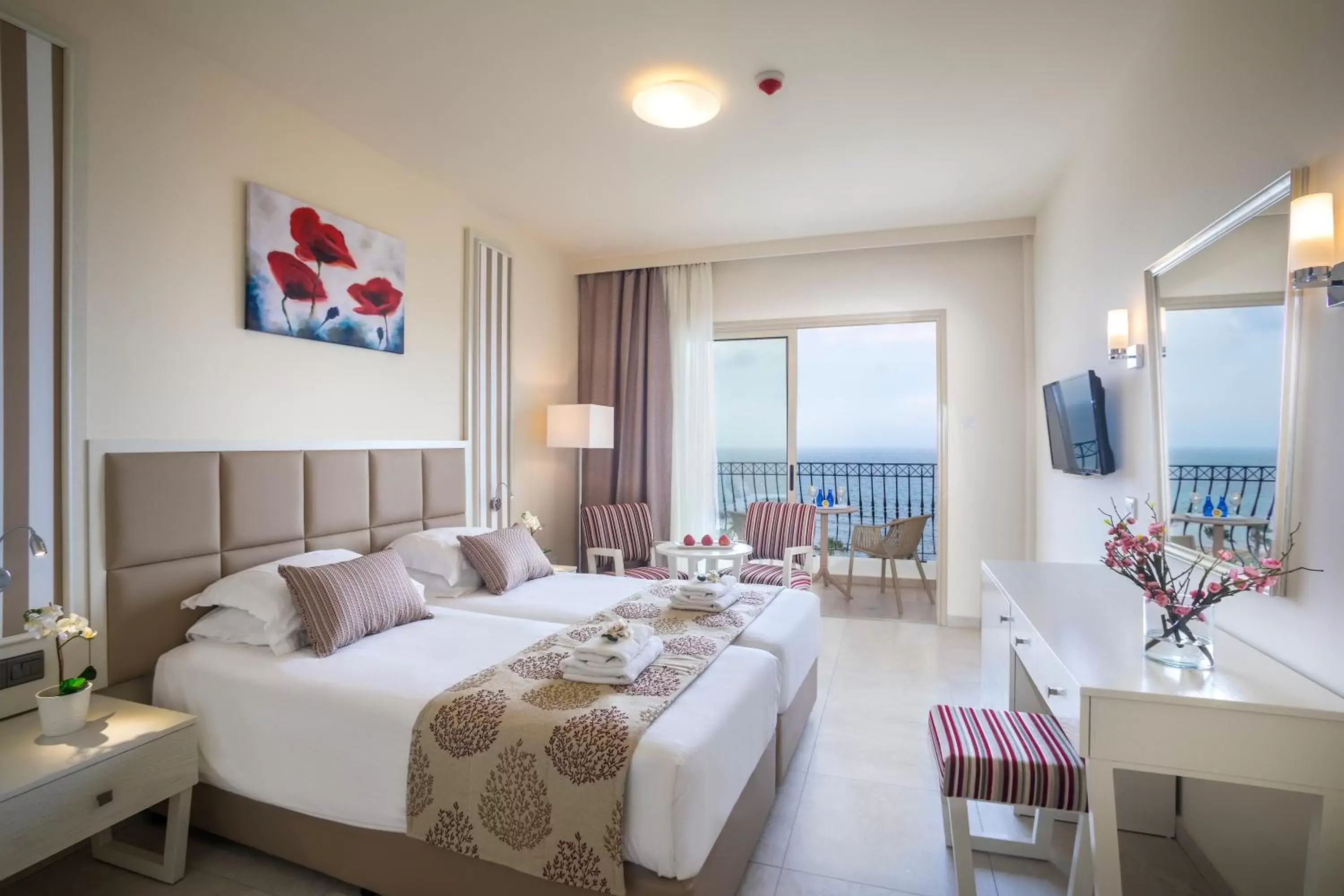 Bed in Aquamare Beach Hotel & Spa