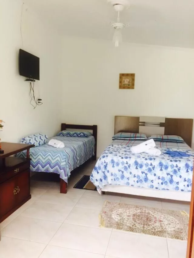 Bed in Pousada Recanto do Teimoso