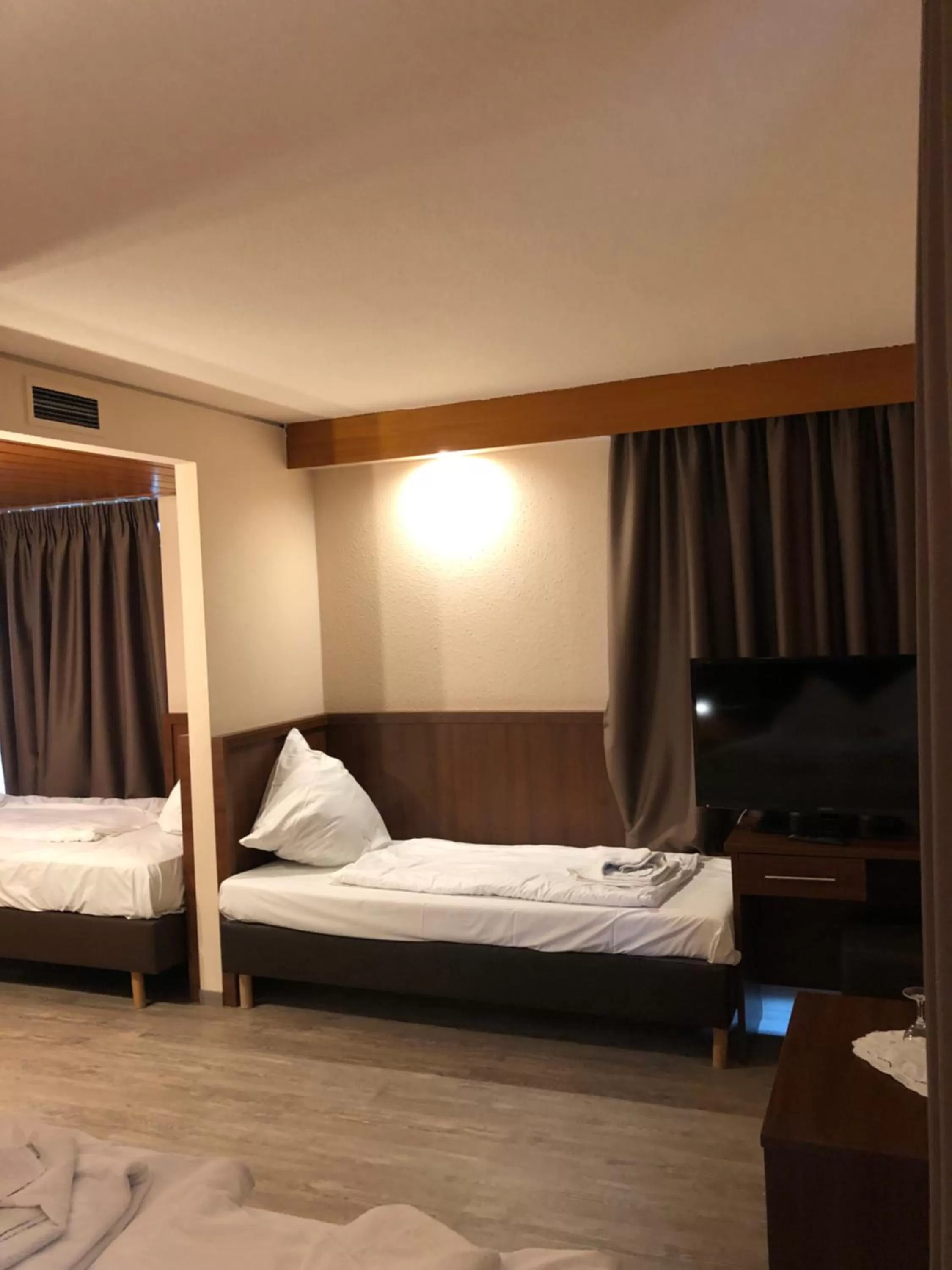 Bed in Hotel Poseidon