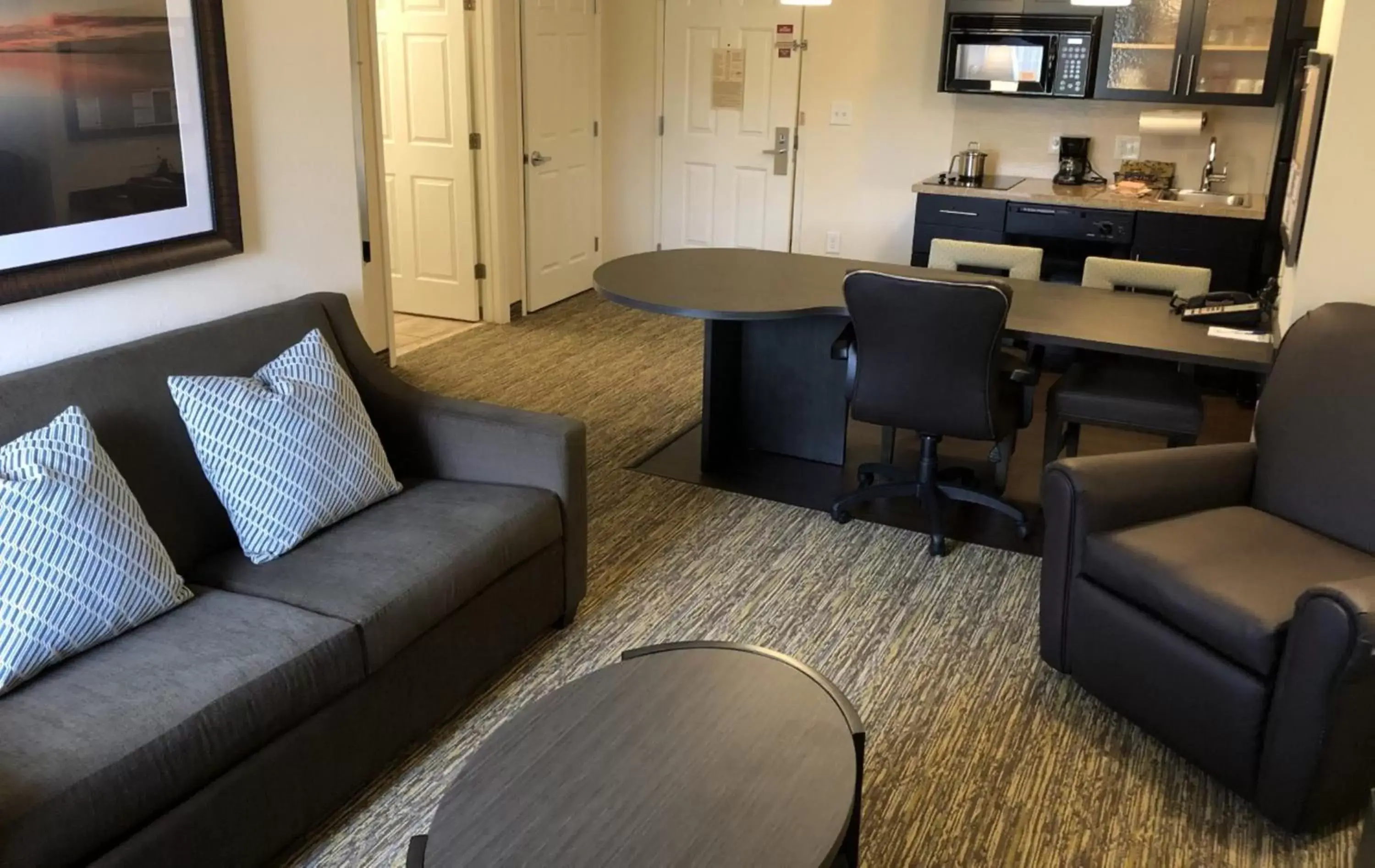 Living room, Seating Area in Candlewood Suites Greenville NC, an IHG Hotel