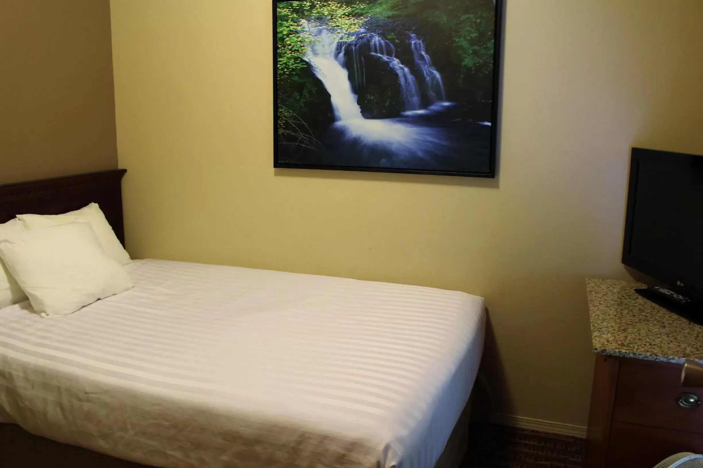 Bed in Ramada by Wyndham Campbell River